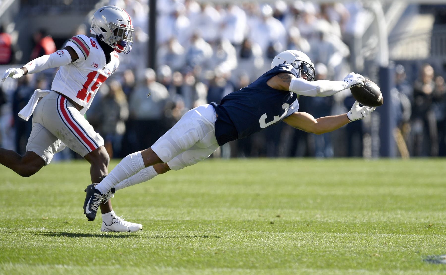 UNIVERSITY PARK, PA - OCTOBER 29: Penn State wide receiver Parker Washington (3) makes a diving catch while Ohio State safety Tanner McCalister (15) covers him during the Ohio State Buckeyes versus Penn State Nittany Lions game on October 29, 2022 at Beaver Stadium in University Park, PA. (Photo by Randy Litzinger/Icon Sportswire via Getty Images)