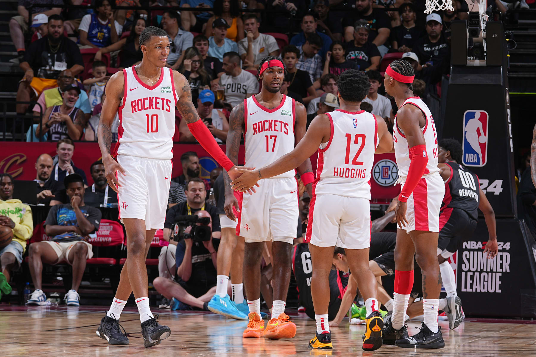 LAS VEGAS, NV - JULY 7: Jabari Smith Jr. #10 of the Houston Rockets high fives Trevor Hudgins #12 during the 2023 NBA Las Vegas Summer League on July 7, 2023 at the Thomas & Mack Center in Las Vegas, Nevada. NOTE TO USER: User expressly acknowledges and agrees that, by downloading and or using this photograph, User is consenting to the terms and conditions of the Getty Images License Agreement. Mandatory Copyright Notice: Copyright 2023 NBAE (Photo by Bart Young/NBAE via Getty Images)