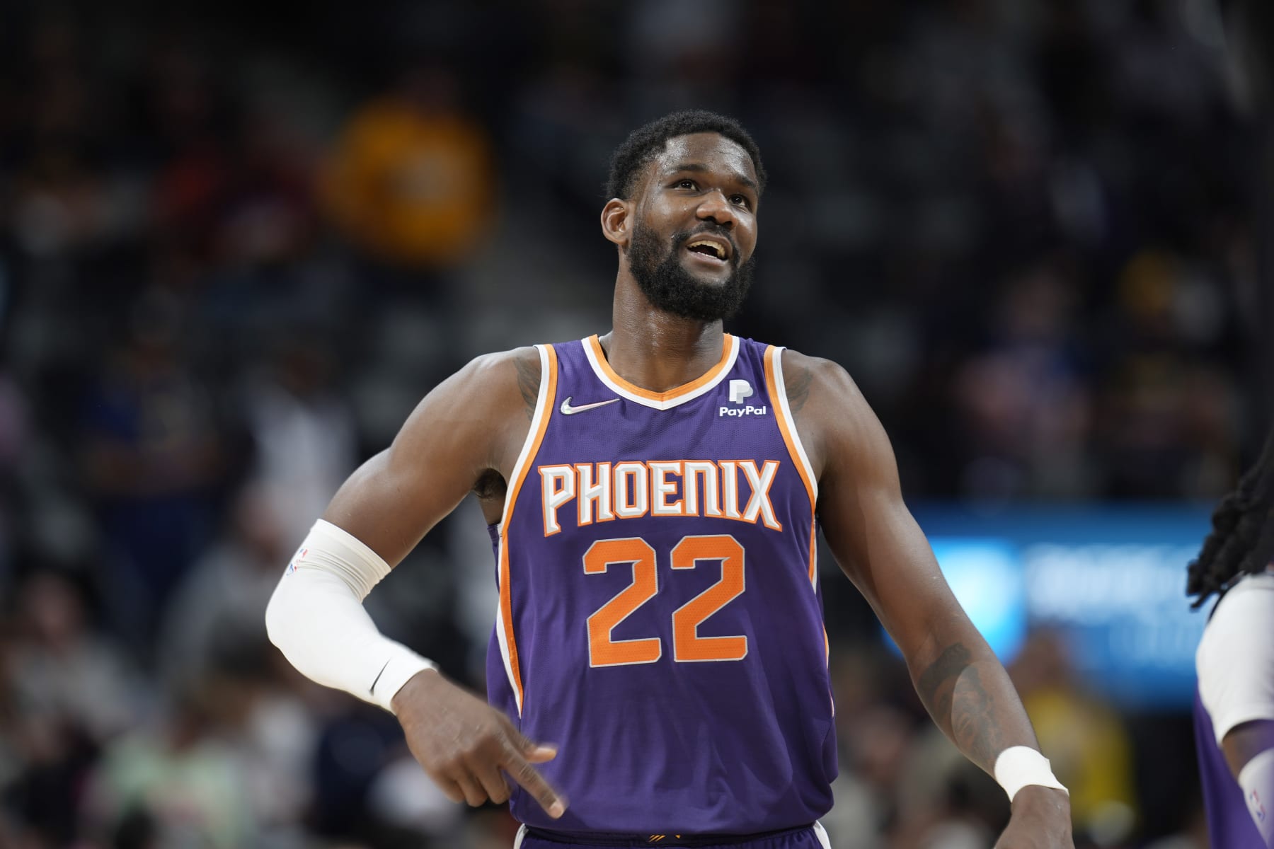Phoenix Suns center Deandre Ayton (22) in the second half of an NBA basketball game Thursday, March 24, 2022, in Denver. (AP Photo/David Zalubowski)