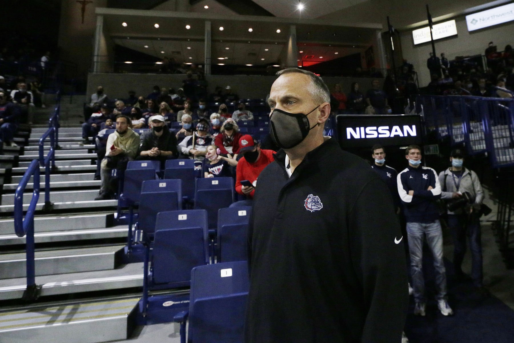 Gonzaga athletic director Chris Standiford looks on before the team's college basketball exhibition game against Lewis-Clark State, Friday, Nov. 5, 2021, in Spokane, Wash. (AP Photo/Young Kwak)