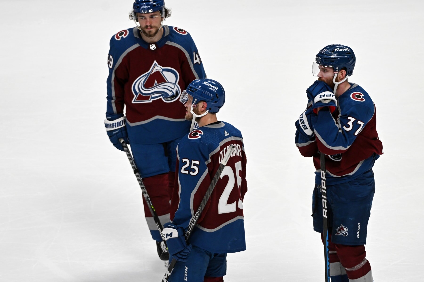 DENVER, CO - APRIL 30: Colorado Avalanche defenseman Samuel Girard (49), Colorado Avalanche right wing Logan O'Connor (25), and Colorado Avalanche left wing J.T. Compher (37) right, look dejected on the ice after losing Game 7 of the NHL Stanley Cup playoffs at Ball Arena on April 30, 2023 in Denver, Colorado. The Seattle Kraken beat the Avalanche 2-1. (Photo by Helen H. Richardson/MediaNews Group/The Denver Post via Getty Images)