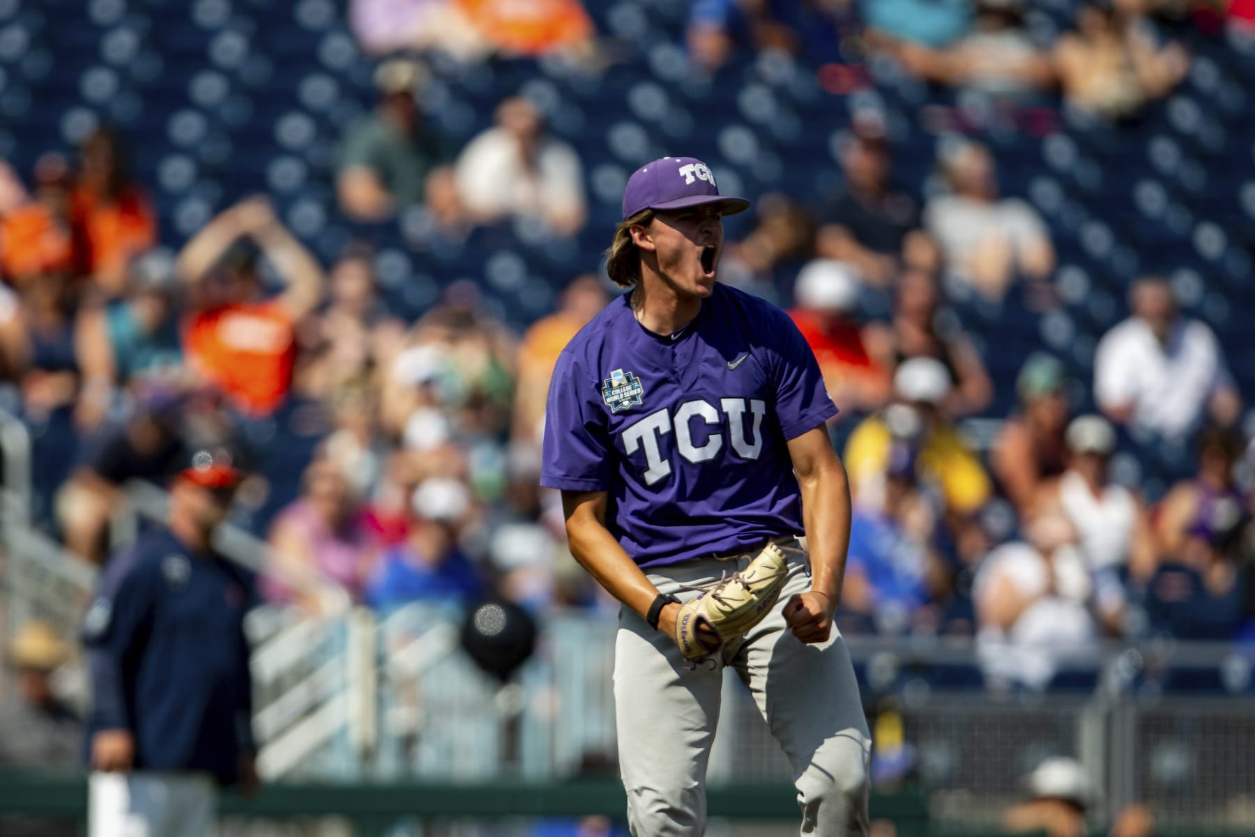TCU pitcher Ben Abeldt celebrates after a win over Virginia in a baseball game at the NCAA College World Series in Omaha, Neb., Sunday, June 18, 2023. (AP Photo/John Peterson)