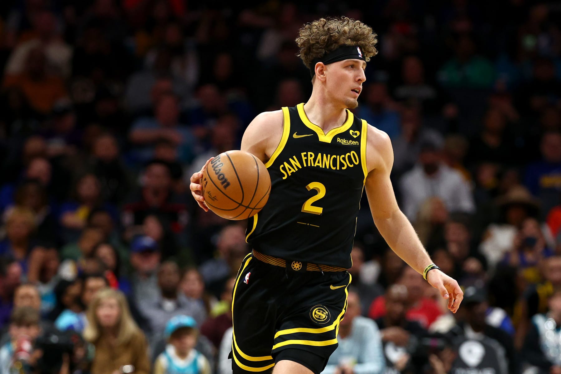 CHARLOTTE, NORTH CAROLINA - MARCH 29: Brandin Podziemski #2 of the Golden State Warriors brings the ball up court during the first half of the game against the Charlotte Hornets at Spectrum Center on March 29, 2024 in Charlotte, North Carolina. NOTE TO USER: User expressly acknowledges and agrees that, by downloading and or using this photograph, User is consenting to the terms and conditions of the Getty Images License Agreement. (Photo by Jared C. Tilton/Getty Images)