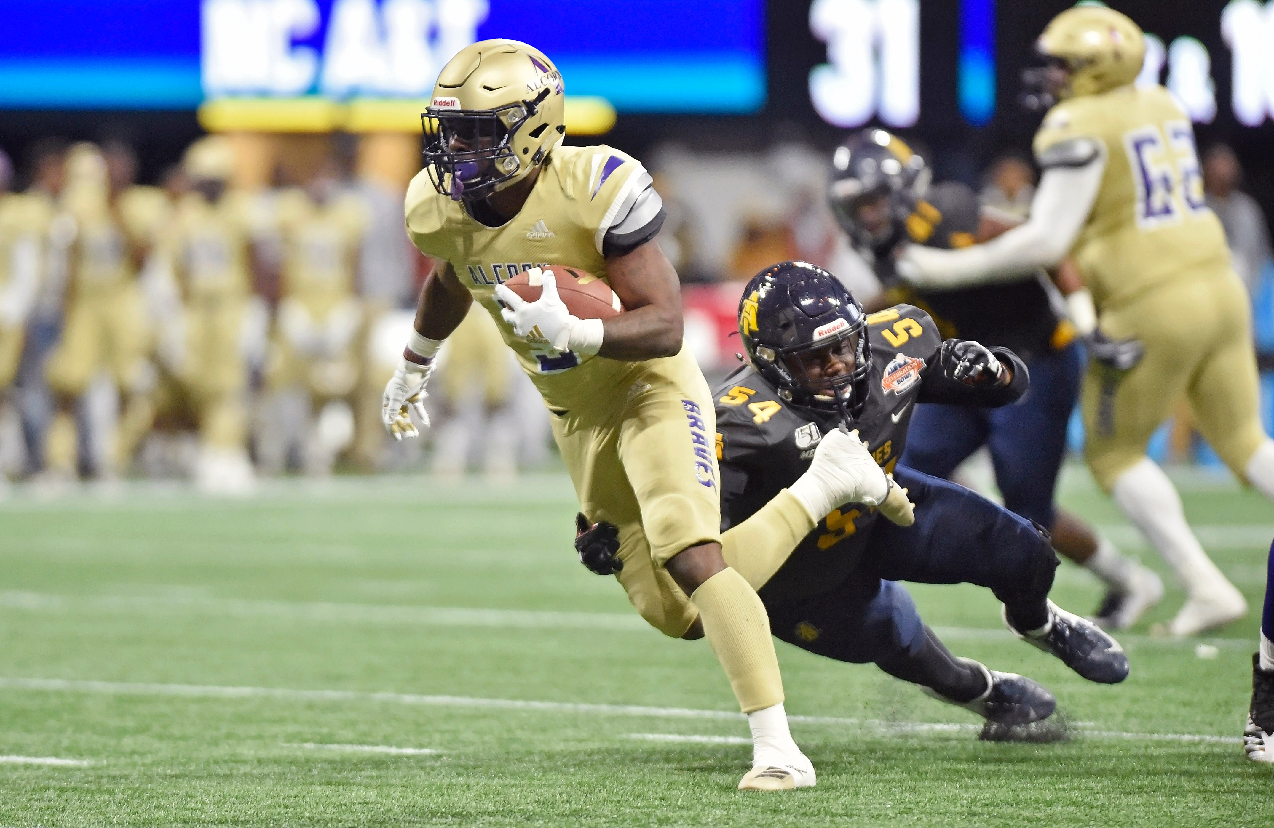 ATLANTA, GA - DECEMBER 21: Alcorn State receiver LeCharles Pringle (left) tries to break free of North Carolina A&T linebacker Kyin Howard (54) during the third quarter of an NCAA college football game in the Celebration Bowl on December 21, 2019, at Mercedes-Benz Stadium. (Photo by Austin McAfee/Icon Sportswire via Getty Images)