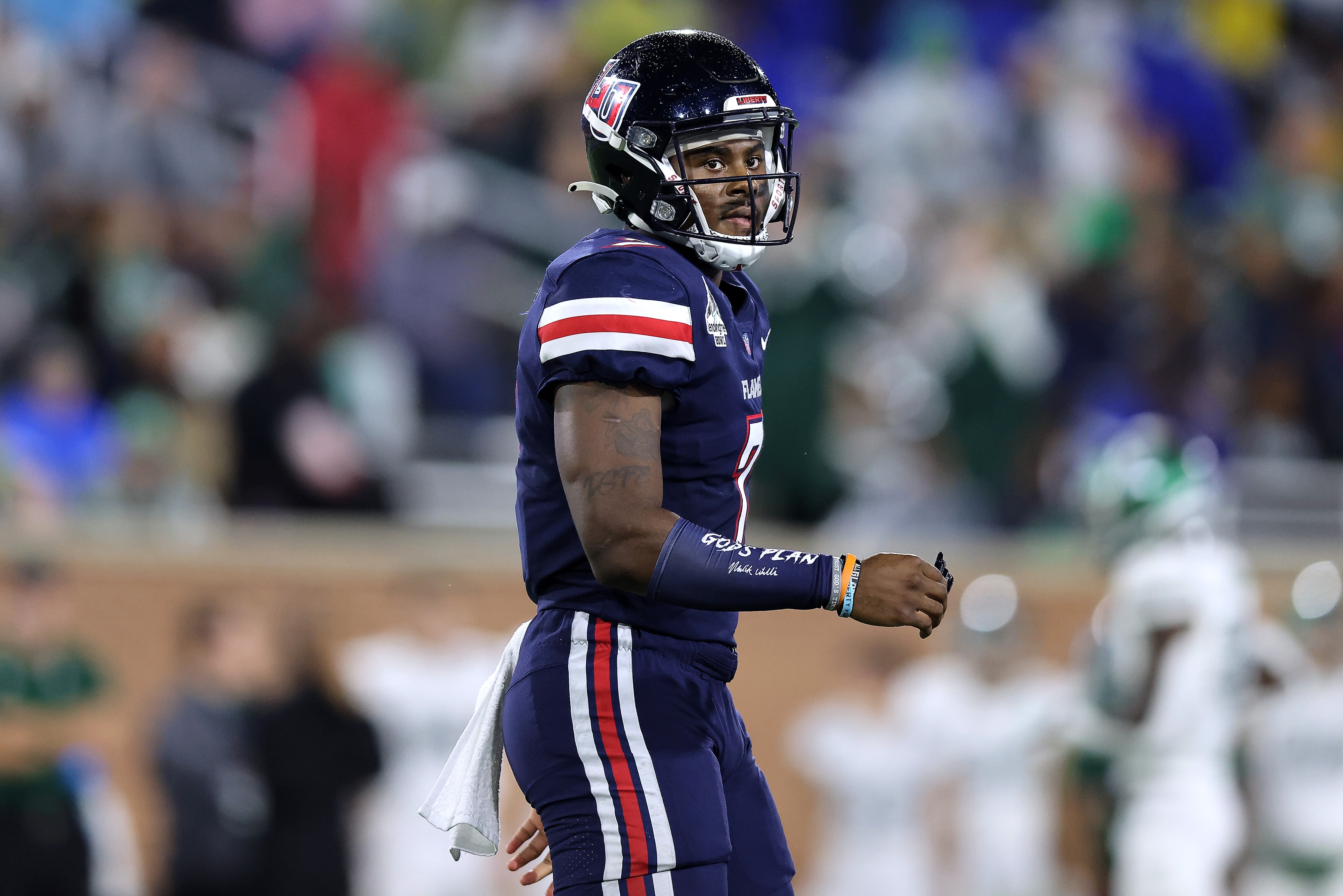 MOBILE, ALABAMA - DECEMBER 18: Malik Willis #7 of the Liberty Flames reacts during the LendingTree Bowl at Hancock Whitney Stadium on December 18, 2021 in Mobile, Alabama. (Photo by Jonathan Bachman/Getty Images)