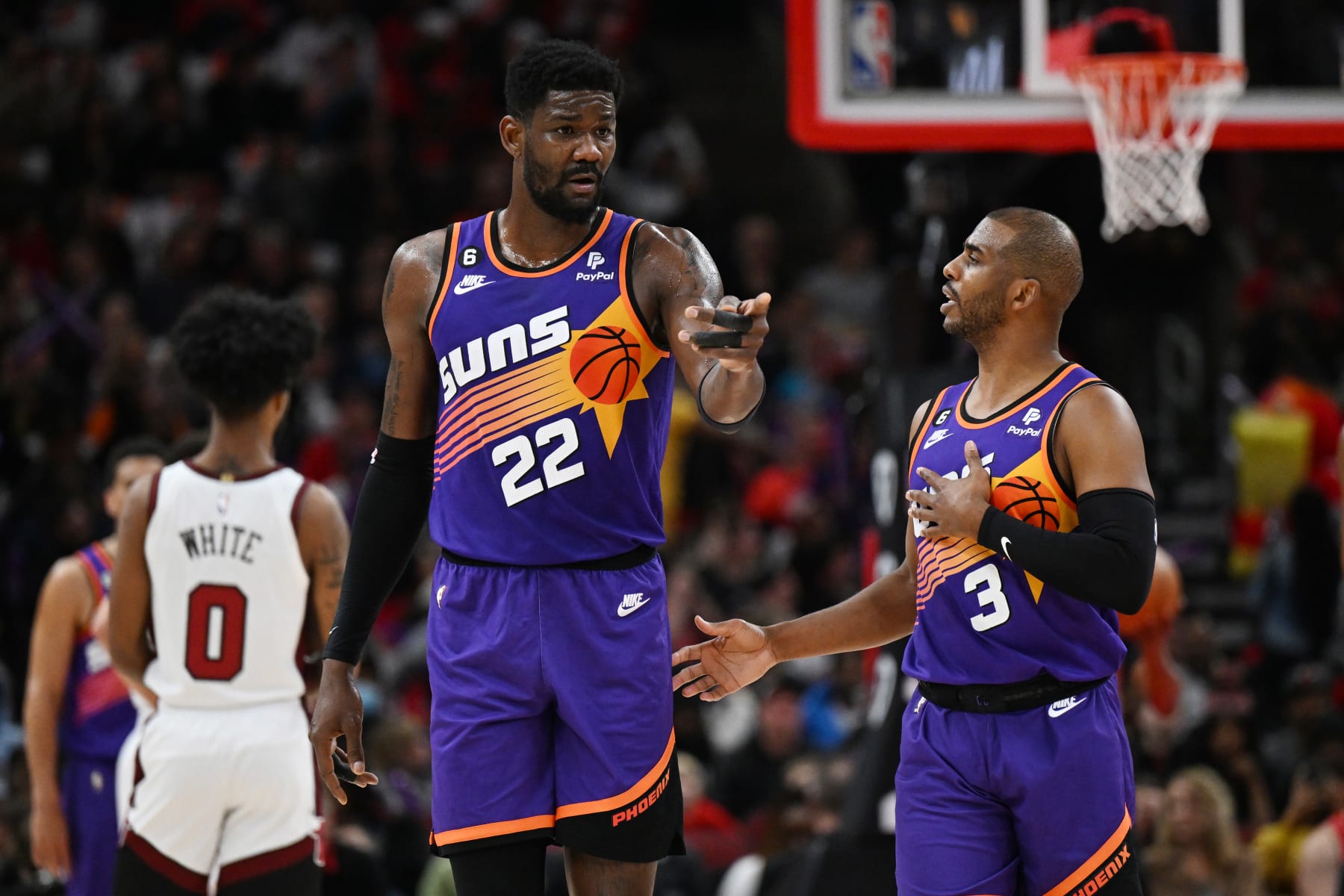 CHICAGO, ILLINOIS - MARCH 03: Deandre Ayton #22 and Chris Paul #3 of the Phoenix Suns talk during a break in play in the first half against the Chicago Bulls at United Center on March 03, 2023 in Chicago, Illinois.  NOTE TO USER: User expressly acknowledges and agrees that, by downloading and or using this photograph, User is consenting to the terms and conditions of the Getty Images License Agreement.  (Photo by Quinn Harris/Getty Images)