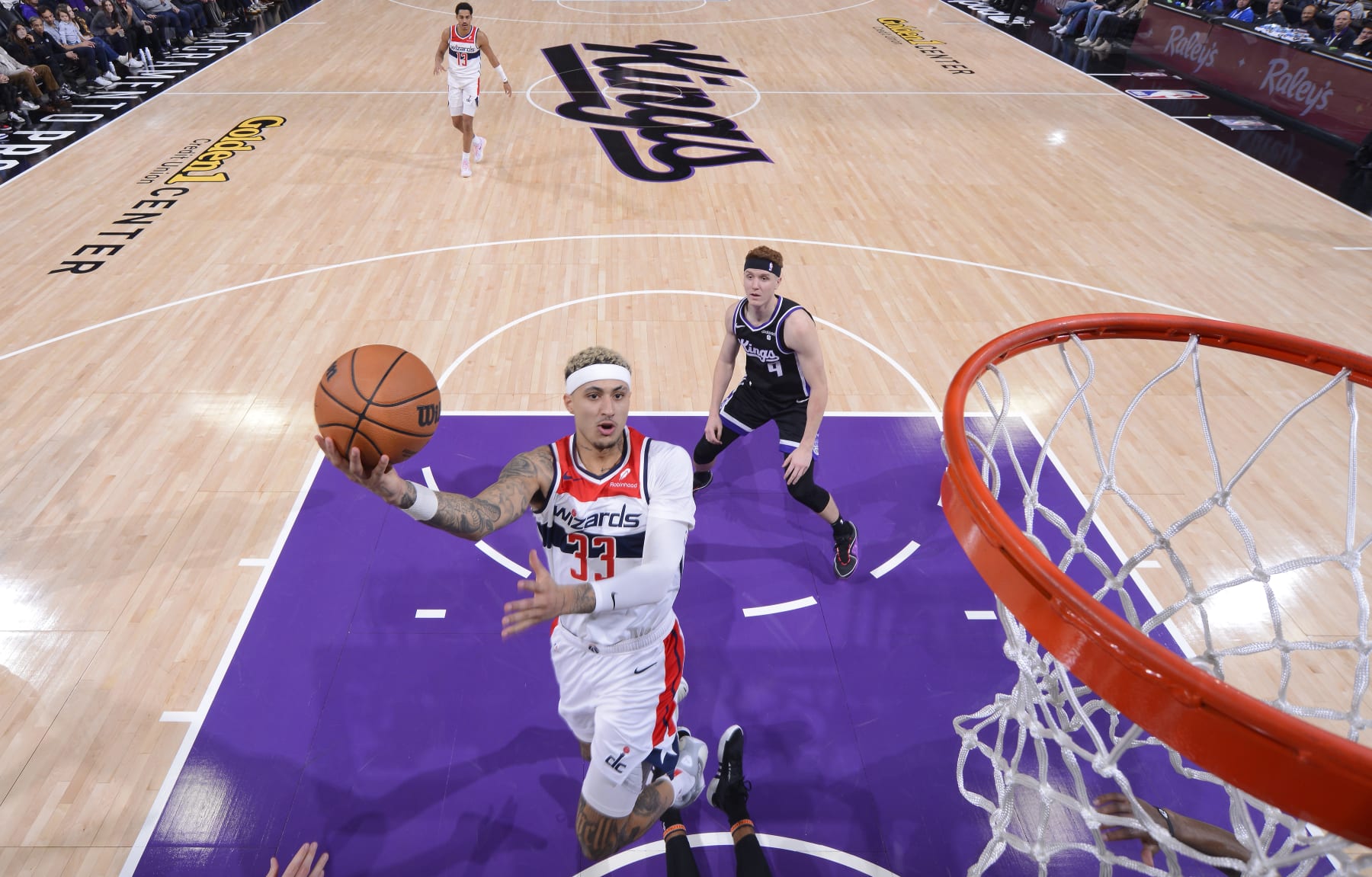 SACRAMENTO, CA - DECEMBER 18: Kyle Kuzma #33 of the Washington Wizards drives to the basket during the game against the Sacramento Kings on December 18, 2023 at Golden 1 Center in Sacramento, California. NOTE TO USER: User expressly acknowledges and agrees that, by downloading and or using this photograph, User is consenting to the terms and conditions of the Getty Images Agreement. Mandatory Copyright Notice: Copyright 2023 NBAE (Photo by Rocky Widner/NBAE via Getty Images)