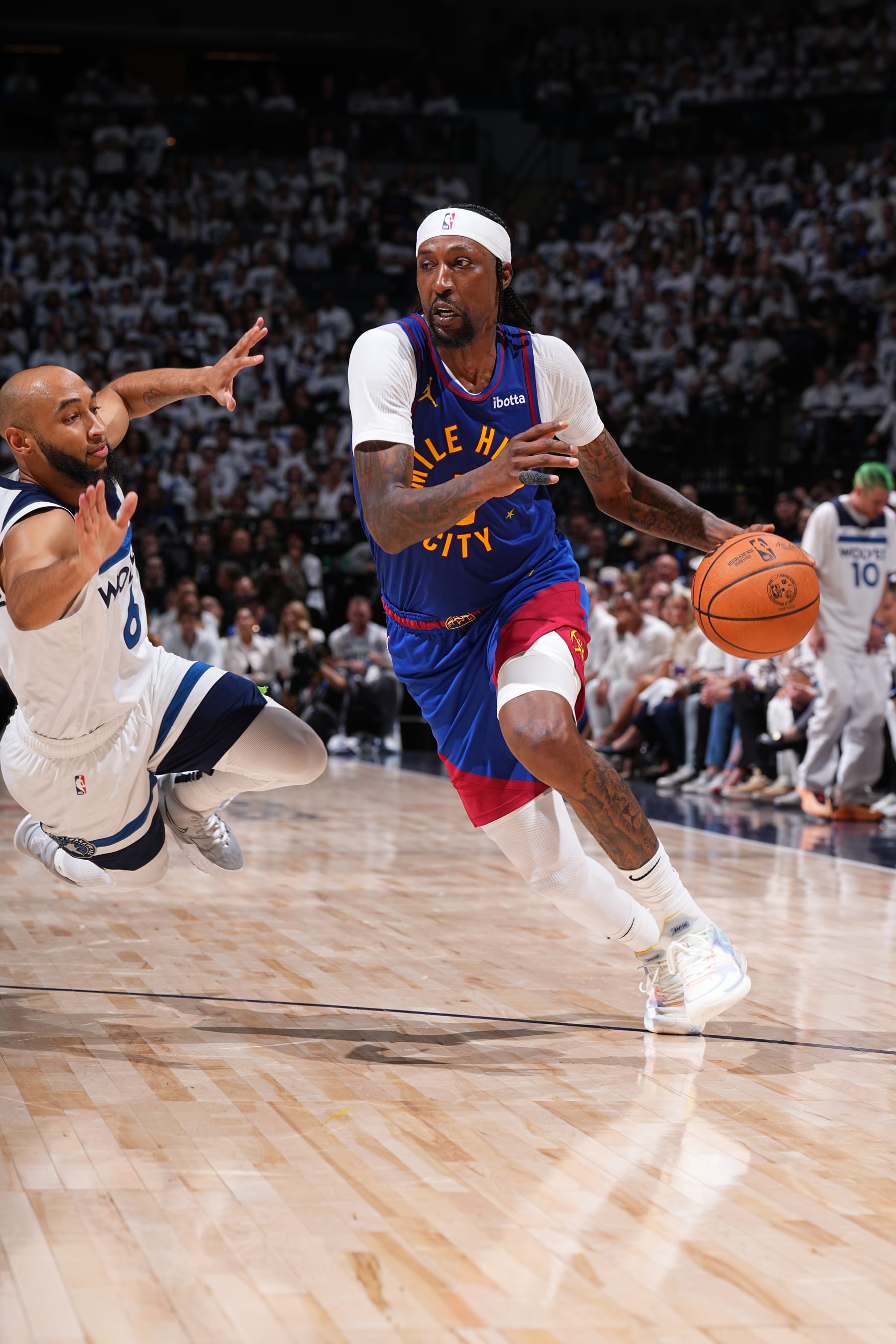 MINNEAPOLIS, MN - MAY 10: Kentavious Caldwell-Pope #5 of the Denver Nuggets dribbles the ball during the game against the Minnesota Timberwolves during Round 2 Game 3 of the 2024 NBA Playoffs on May 10, 2024 at Target Center in Minneapolis, Minnesota. NOTE TO USER: User expressly acknowledges and agrees that, by downloading and or using this Photograph, user is consenting to the terms and conditions of the Getty Images License Agreement. Mandatory Copyright Notice: Copyright 2024 NBAE (Photo by Garrett Ellwood/NBAE via Getty Images)