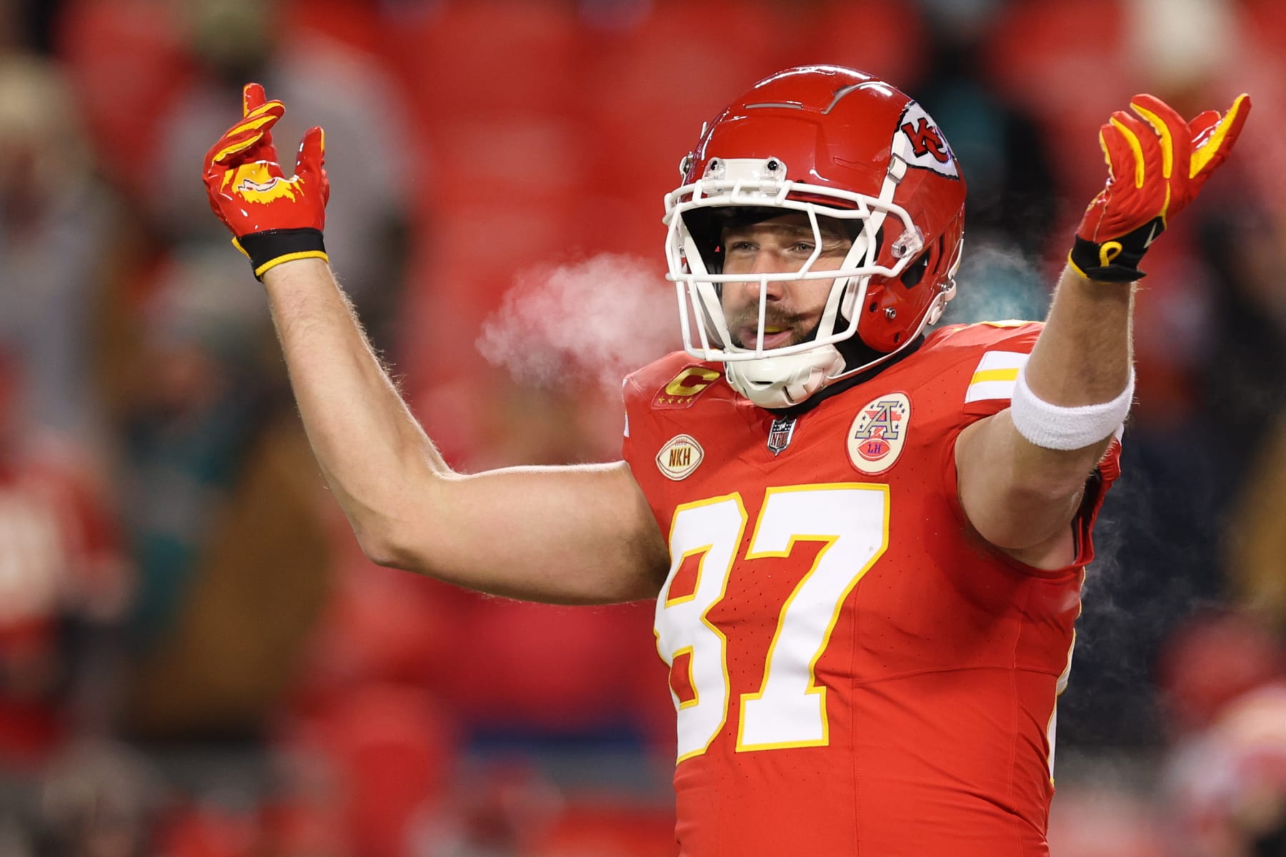 KANSAS CITY, MISSOURI - JANUARY 13: Travis Kelce #87 of the Kansas City Chiefs warms up before the AFC Wild Card Playoffs against the Miami Dolphins at GEHA Field at Arrowhead Stadium on January 13, 2024 in Kansas City, Missouri. (Photo by Jamie Squire/Getty Images)