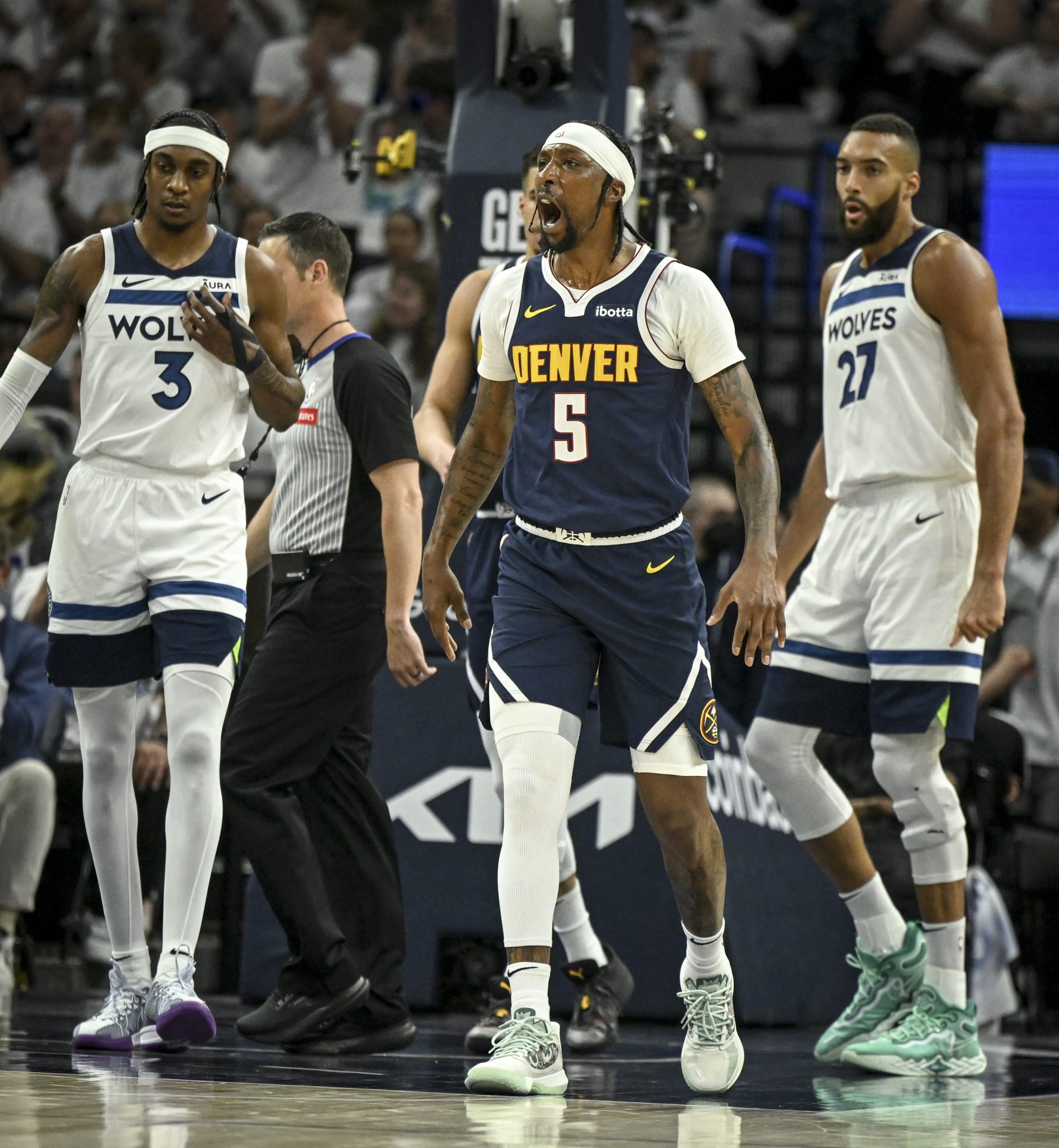 MINNEAPOLIS , MN - MAY 12: Kentavious Caldwell-Pope (5) of the Denver Nuggets reacts to being called for a foul during the first quarter against the Minnesota Timberwolves at Target Center in Minneapolis, Minnesota on Sunday, May 12, 2024. (Photo by AAron Ontiveroz/The Denver Post)