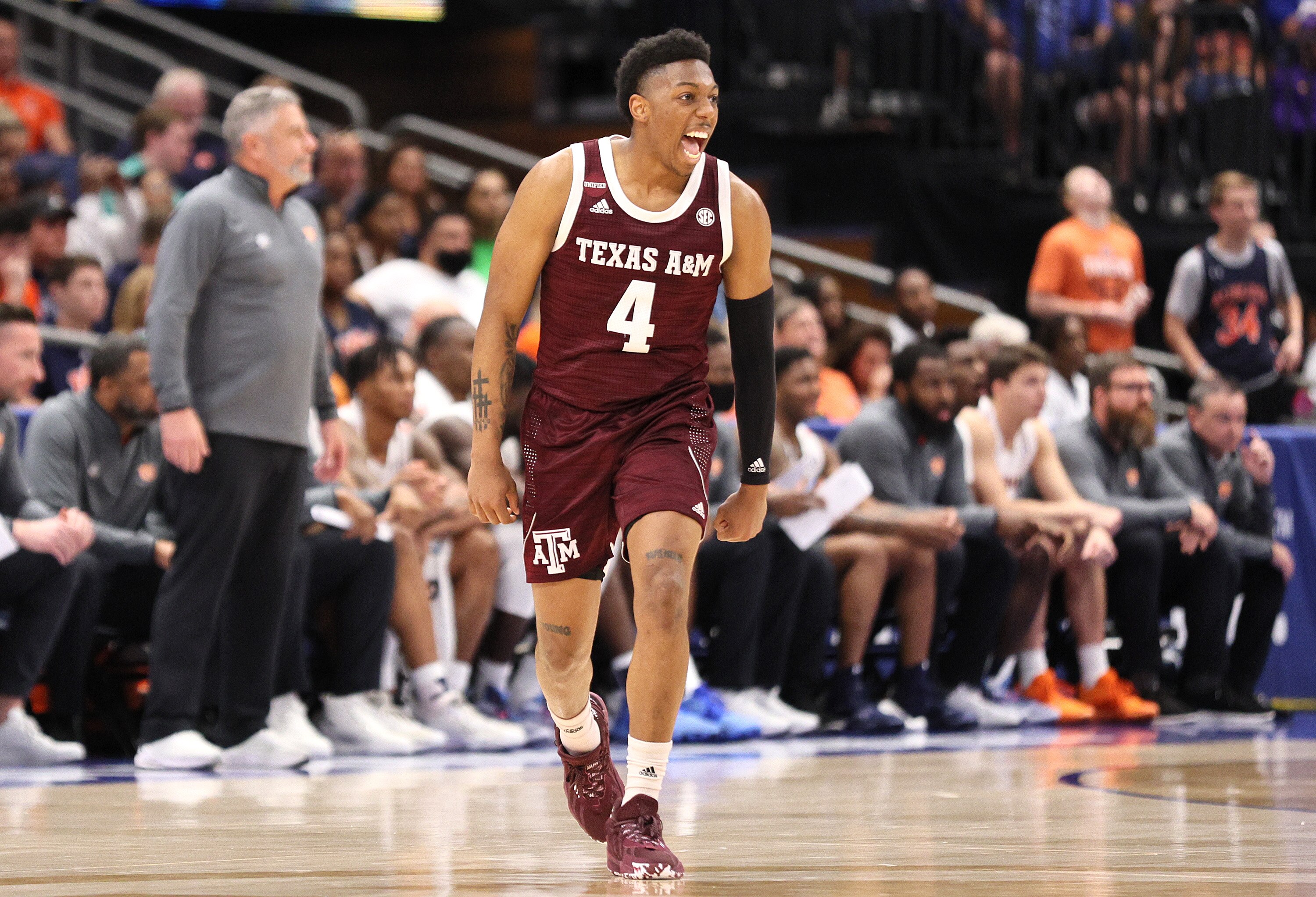 TAMPA, FLORIDA - MARCH 11: Wade Taylor IV #4 of the Texas A&M Aggies reacts against the Auburn Tigers during the first half in the Quarterfinal game of the SEC Men's Basketball Tournament at Amalie Arena on March 11, 2022 in Tampa, Florida. (Photo by Andy Lyons/Getty Images)