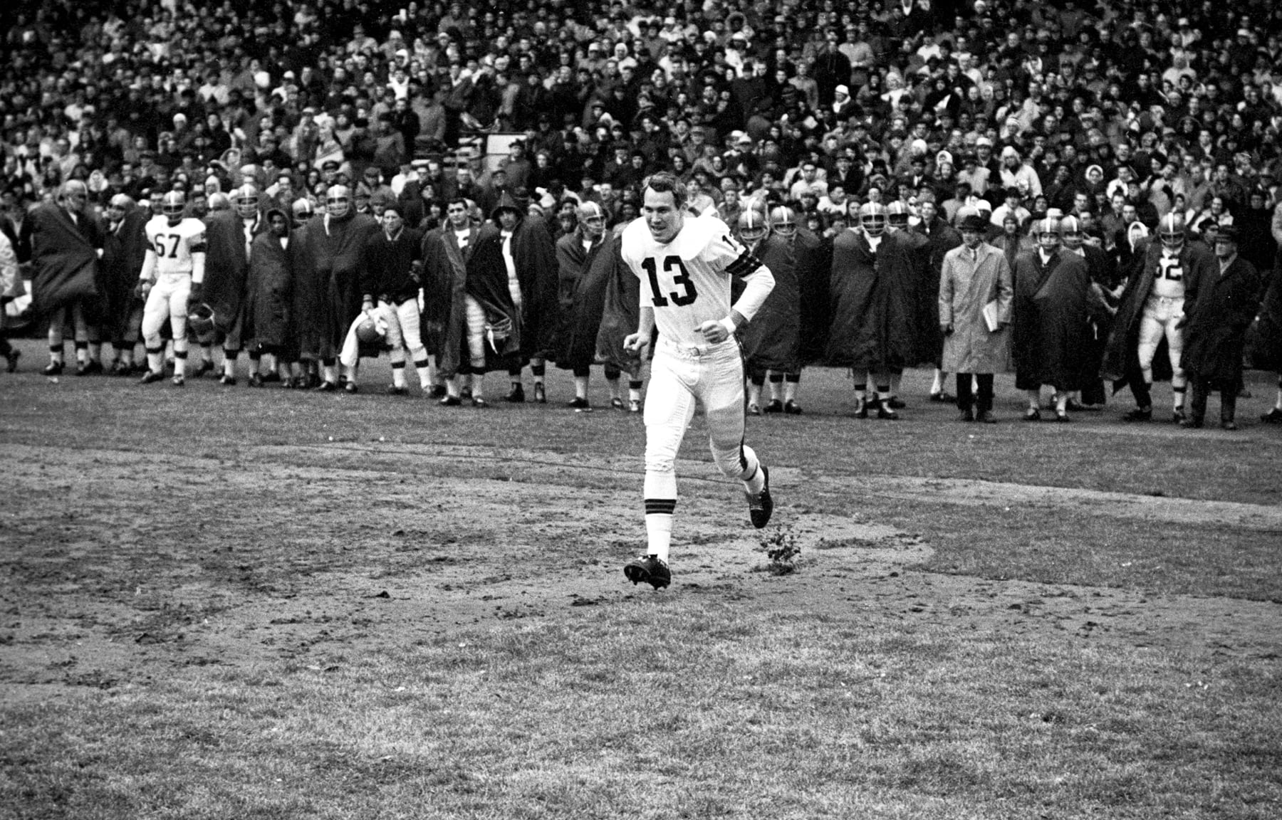 CLEVELAND - DECEMBER 27:  Quarterback Frank Ryan#13 of the Cleveland Browns, is announced onto the field prior to the NFL Championship Game on December 27, 1964 against the Baltimore Colts at Municipal Stadium in Cleveland, Ohio.  The Browns beat the Colts, 27-0, in front of 79,544 fans. (Photo by: Diamond Images/Getty Images)