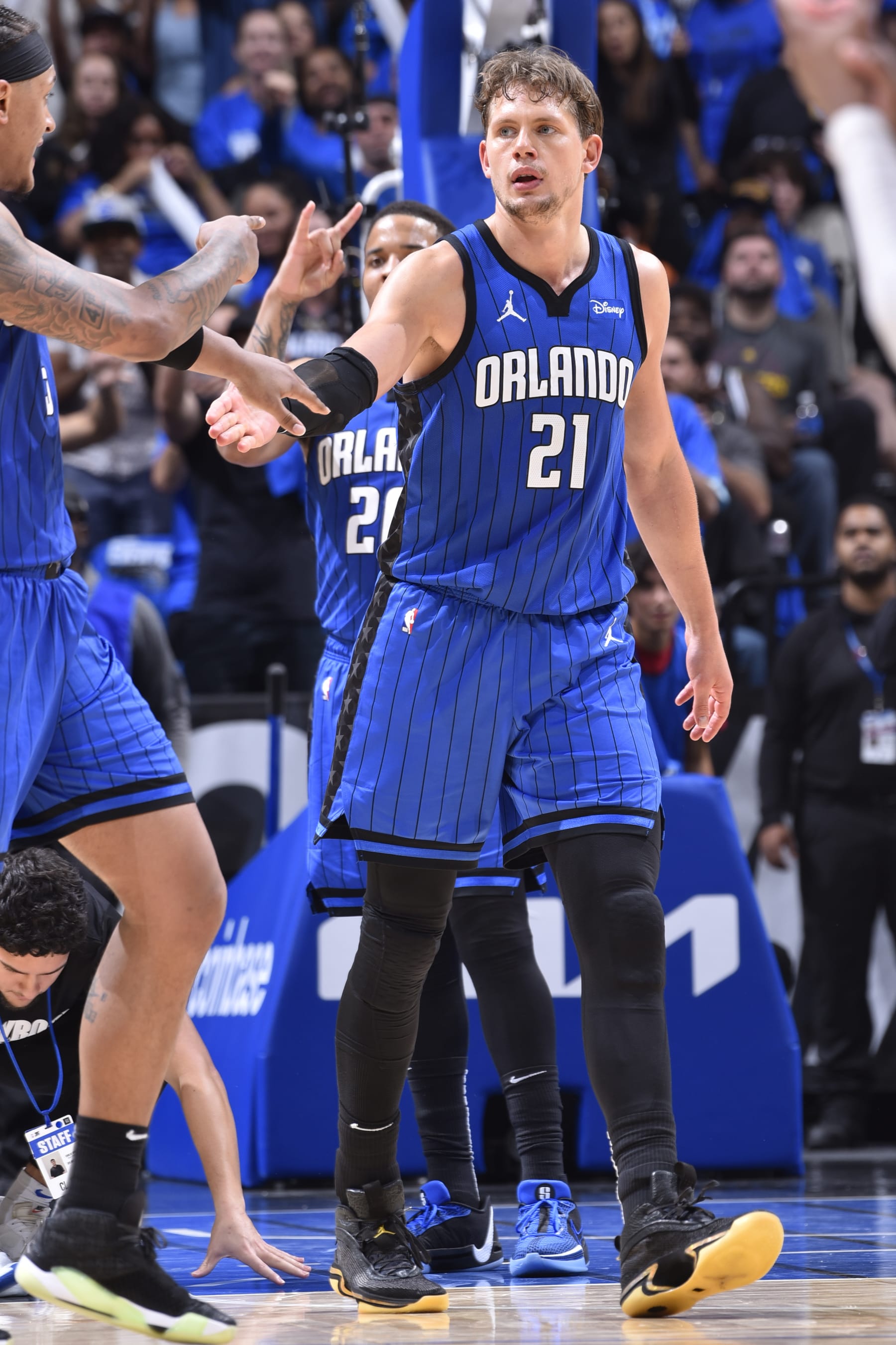 ORLANDO, FL - MAY 3: Moritz Wagner #21 of the Orlando Magic and Paolo Banchero #5 of the Orlando Magic high five during the game against the Cleveland Cavaliers during Round One Game Six of the 2024 NBA Playoffs on May 3, 2024 at the Kia Center in Orlando, Florida. NOTE TO USER: User expressly acknowledges and agrees that, by downloading and or using this photograph, User is consenting to the terms and conditions of the Getty Images License Agreement. Mandatory Copyright Notice: Copyright 2024 NBAE (Photo by Gary Bassing/NBAE via Getty Images)