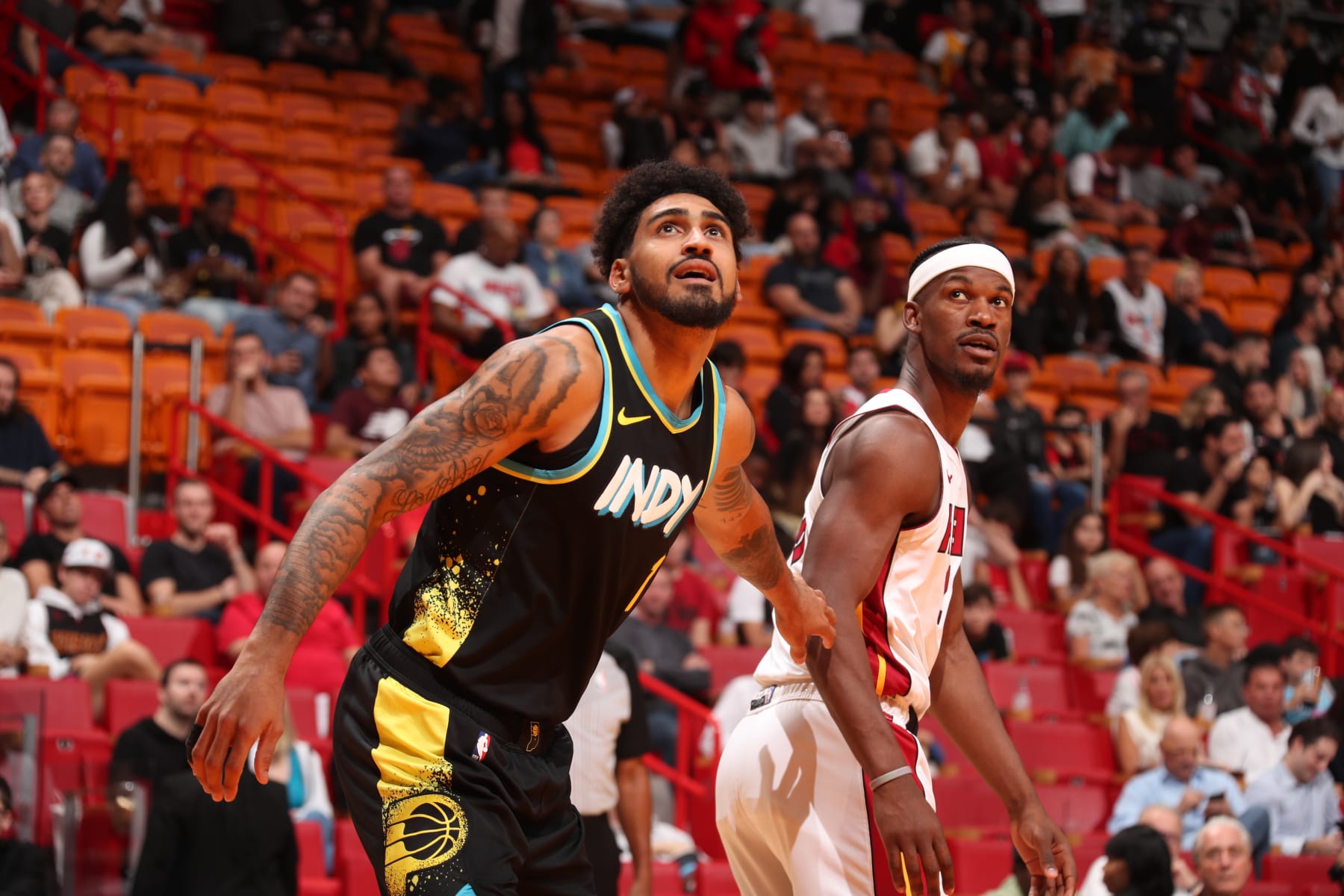 MIAMI, FL - DECEMBER 2: Obi Toppin #1 of the Indiana Pacers and Jimmy Butler #22 of the Miami Heat look on during the game on December 2, 2023 at Kaseya Center in Miami, Florida. NOTE TO USER: User expressly acknowledges and agrees that, by downloading and or using this Photograph, user is consenting to the terms and conditions of the Getty Images License Agreement. Mandatory Copyright Notice: Copyright 2023 NBAE (Photo by Issac Baldizon/NBAE via Getty Images)