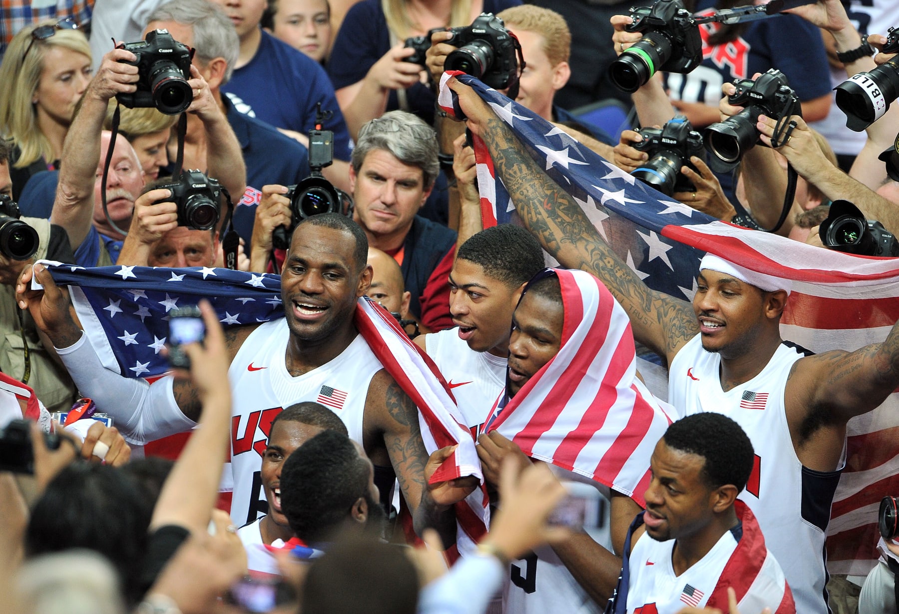 LONDON, ENGLAND - AUGUST 12:  (L-R) LeBron James #6, Kevin Durant #5, Anthony Davis #14 and Carmelo Anthony #15 of the United States celebrate after they won against Spain during the Men's Basketball gold medal game on Day 16 of the London 2012 Olympics Games at North Greenwich Arena on August 12, 2012 in London, England.  (Photo by Pascal Le Segretain/Getty Images)