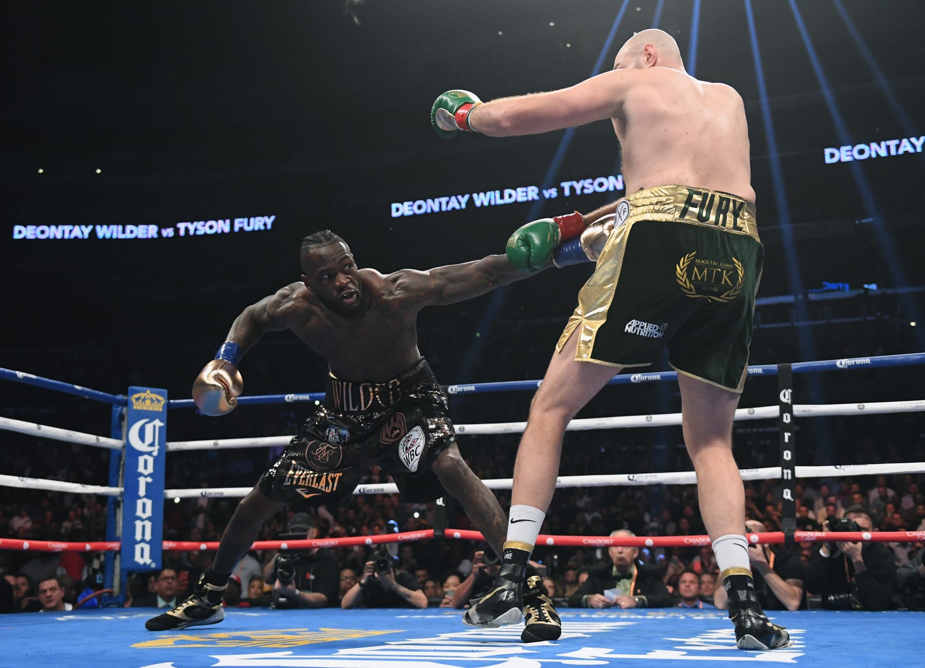 LOS ANGELES, CA - DECEMBER 01:  Deontay Wilder jabs Tyson Fury in the first round, fighting to a draw during the WBC Heavyweight Championship at Staples Center on December 1, 2018 in Los Angeles, California.  (Photo by Harry How/Getty Images)