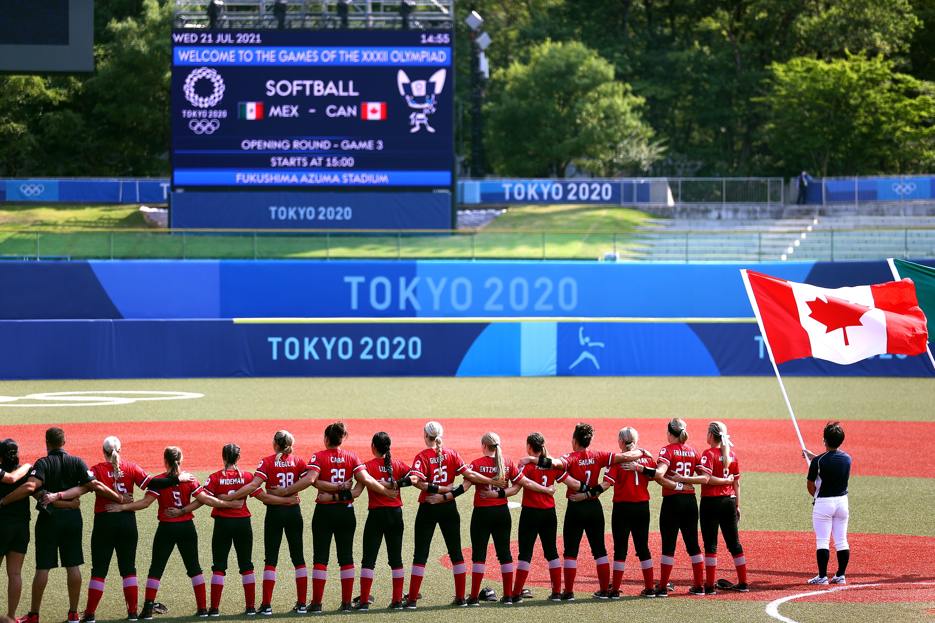 FUKUSHIMA, JAPAN - JULY 21: Team Canada stand during pregame ceremonies before their game against Team Mexico during the Tokyo 2020 Olympic Games at Fukushima Azuma Baseball Stadium on July 21, 2021 in Fukushima, Japan. (Photo by Yuichi Masuda/Getty Images)