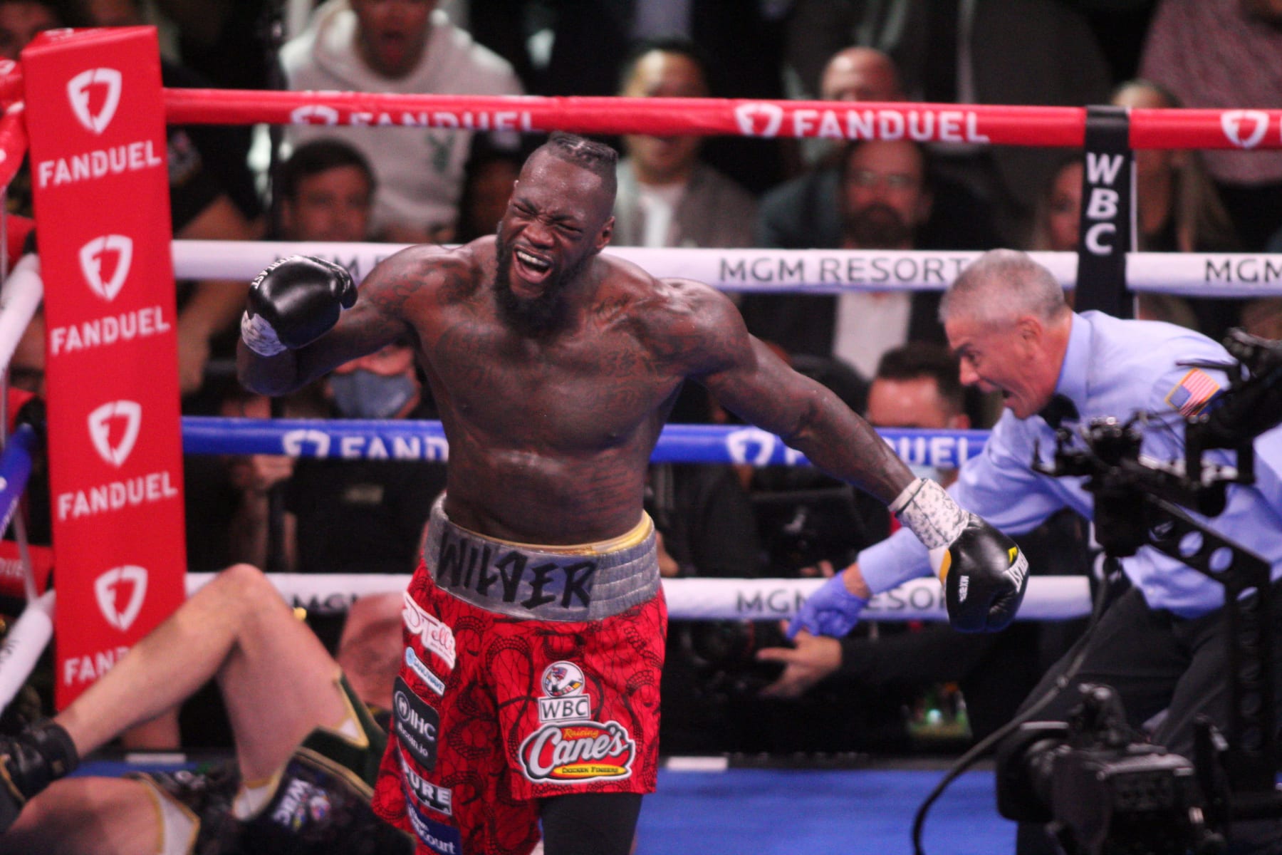 LAS VEGAS, NEVADA - OCTOBER 09: Tyson Fury and Deontay Wilder (C) exchange punches during their fight for the WBC heavyweight championship on October 9, 2021 in Las Vegas, Nevada. (Photo by Tom Hogan/Anadolu Agency via Getty Images)