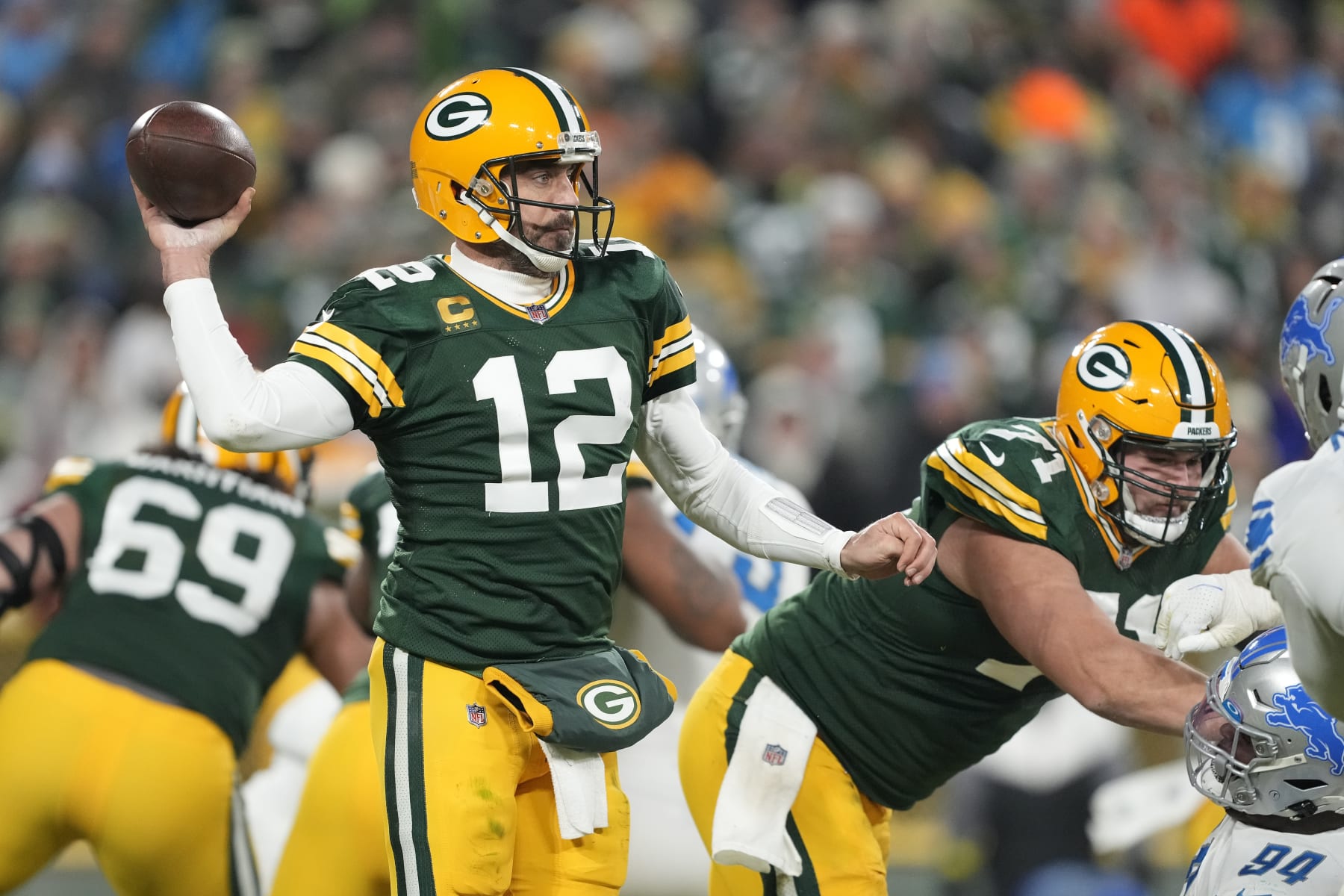 GREEN BAY, WISCONSIN - JANUARY 08: Aaron Rodgers #12 of the Green Bay Packers throws a pass against the Detroit Lions in the second half at Lambeau Field on January 08, 2023 in Green Bay, Wisconsin. (Photo by Patrick McDermott/Getty Images)