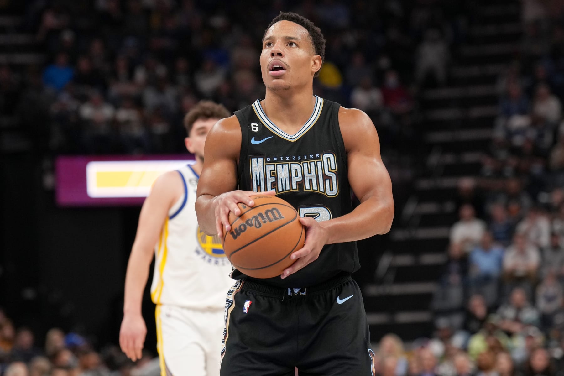 MEMPHIS, TN - MARCH 9: Desmond Bane #22 of the Memphis Grizzlies prepares to shoot a free throw during the game against the Golden State Warriors on March 9, 2023 at FedExForum in Memphis, Tennessee. NOTE TO USER: User expressly acknowledges and agrees that, by downloading and or using this photograph, User is consenting to the terms and conditions of the Getty Images License Agreement. Mandatory Copyright Notice: Copyright 2023 NBAE (Photo by Jesse D. Garrabrant/NBAE via Getty Images)