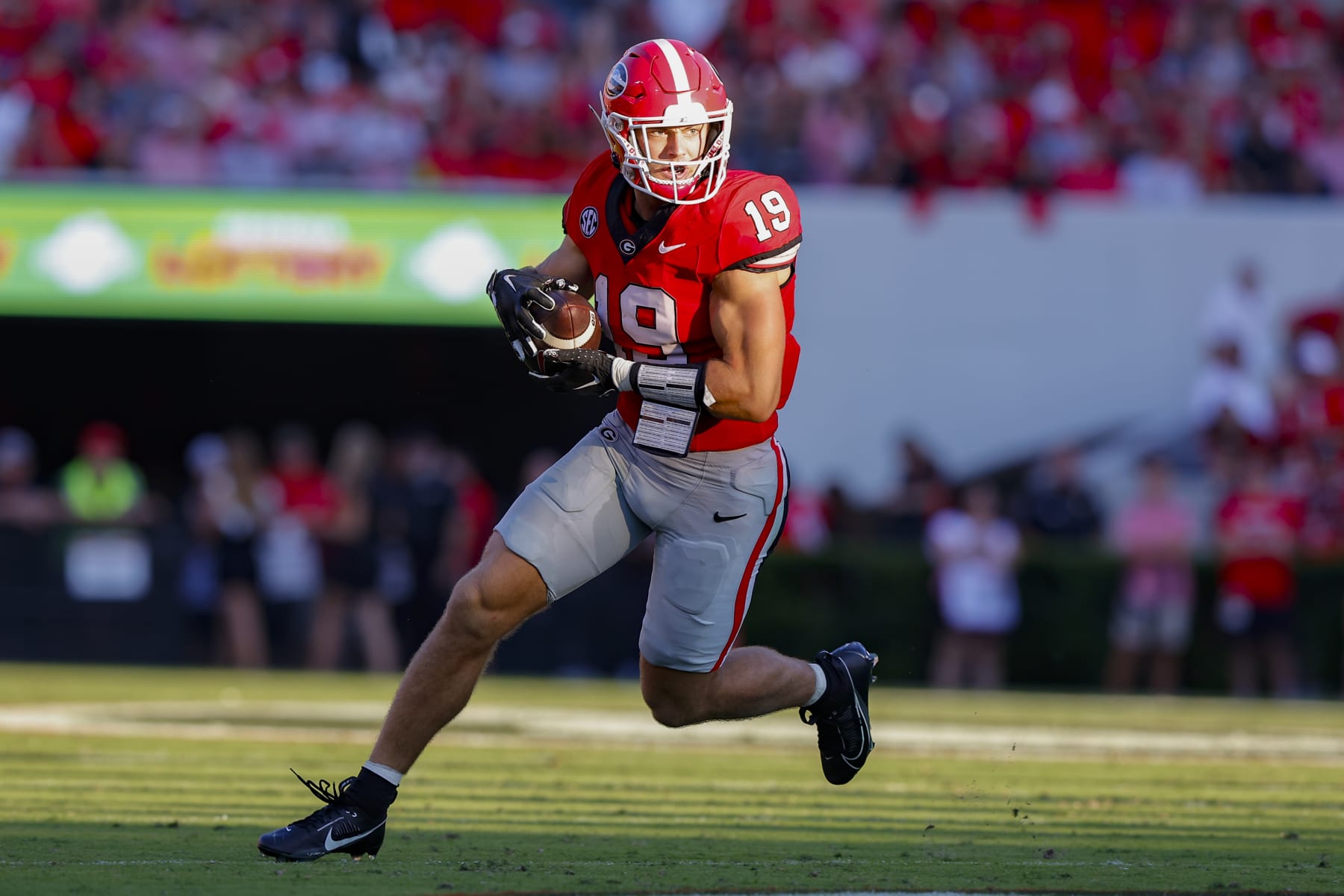 ATHENS, GEORGIA - SEPTEMBER 2: Brock Bowers #19 of the Georgia Bulldogs looks for extra yardage after the reception during the second quarter against the Tennessee Martin Skyhawks at Sanford Stadium on September 2, 2023 in Athens, Georgia. (Photo by Todd Kirkland/Getty Images)