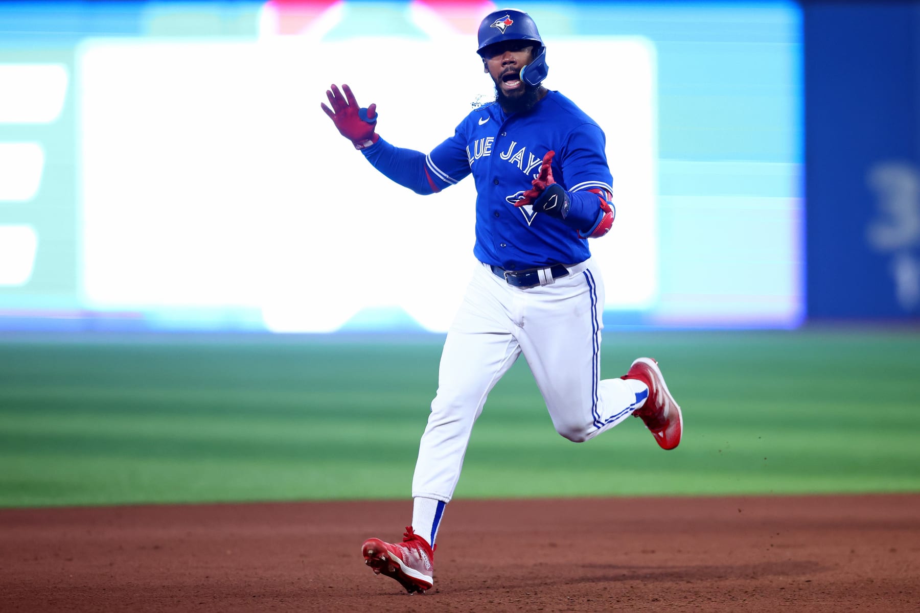 TORONTO, ONTARIO - OCTOBER 08: Teoscar Hernandez #37 of the Toronto Blue Jays celebrates after hitting a home run to center field against Robbie Ray #38 of the Seattle Mariners during the fourth inning in game two of the American League Wild Card Series at Rogers Centre on October 08, 2022 in Toronto, Ontario. (Photo by Vaughn Ridley/Getty Images)