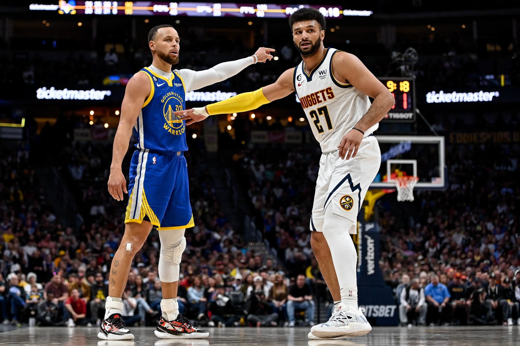 DENVER, CO - APRIL 2:  Stephen Curry #30 of the Golden State Warriors is defended by Jamal Murray #27 of the Denver Nuggets in the second half of a game at Ball Arena on April 2, 2023 in Denver, Colorado. NOTE TO USER: User expressly acknowledges and agrees that, by downloading and or using this photograph, User is consenting to the terms and conditions of the Getty Images License Agreement. (Photo by Dustin Bradford/Getty Images)