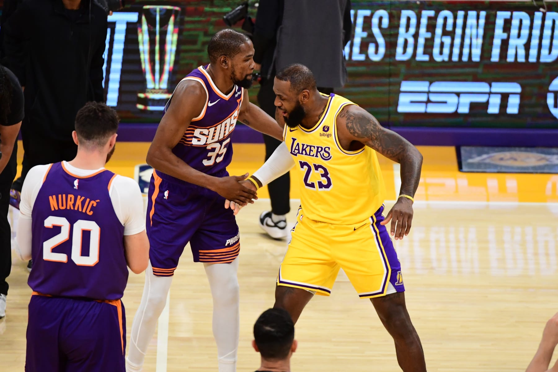 LOS ANGELES, CA - OCTOBER 26: Kevin Durant #35 of the Phoenix Suns greets LeBron James #23 of the Los Angeles Lakers before the game  on October 26, 2023 at Crypto.Com Arena in Los Angeles, California. NOTE TO USER: User expressly acknowledges and agrees that, by downloading and/or using this Photograph, user is consenting to the terms and conditions of the Getty Images License Agreement. Mandatory Copyright Notice: Copyright 2023 NBAE (Photo by Adam Pantozzi/NBAE via Getty Images)