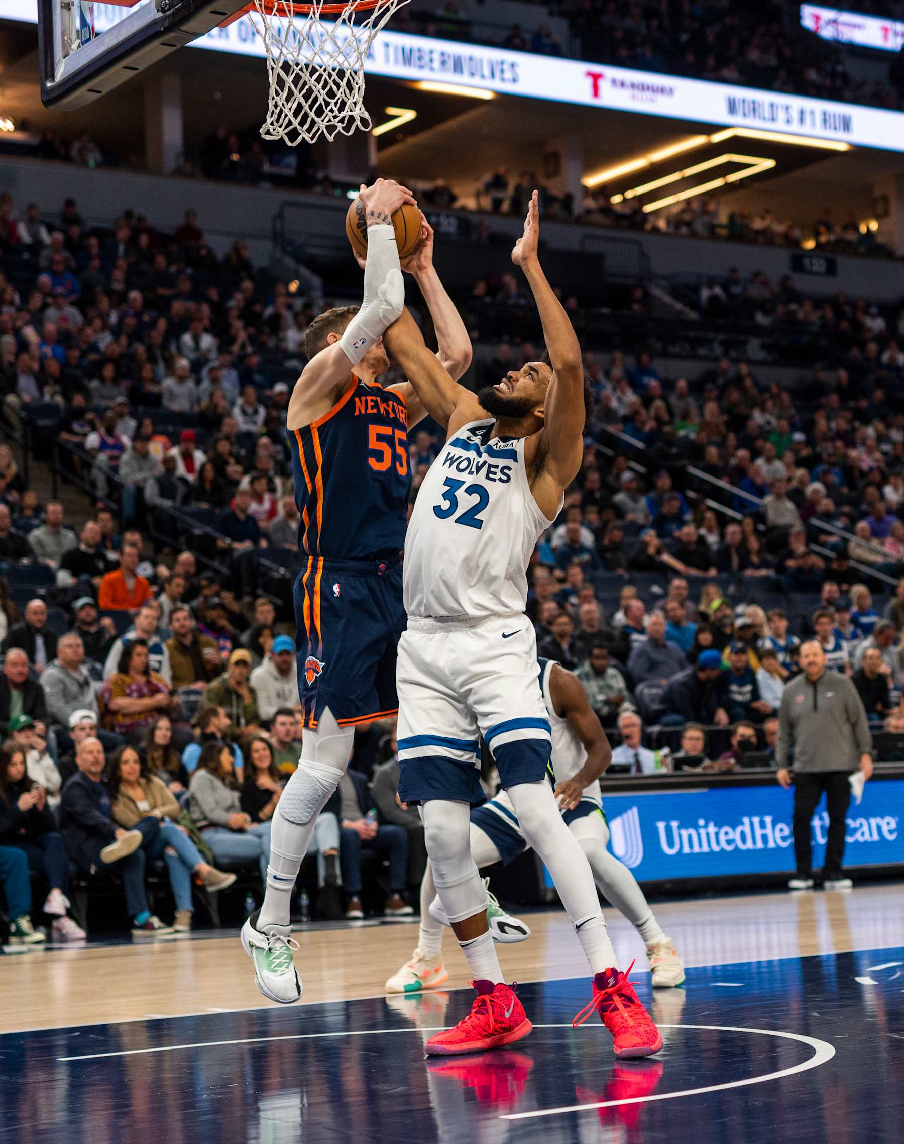 MINNEAPOLIS, MN - NOVEMBER 07: Karl-Anthony Towns #32 of the Minnesota Timberwolves fights for possession with Isaiah Hartenstein #55 of the New York Knicks in the first quarter of the game at Target Center on November 7, 2022 in Minneapolis, Minnesota. NOTE TO USER: User expressly acknowledges and agrees that, by downloading and or using this photograph, User is consenting to the terms and conditions of the Getty Images License Agreement. (Photo by Stephen Maturen/Getty Images)