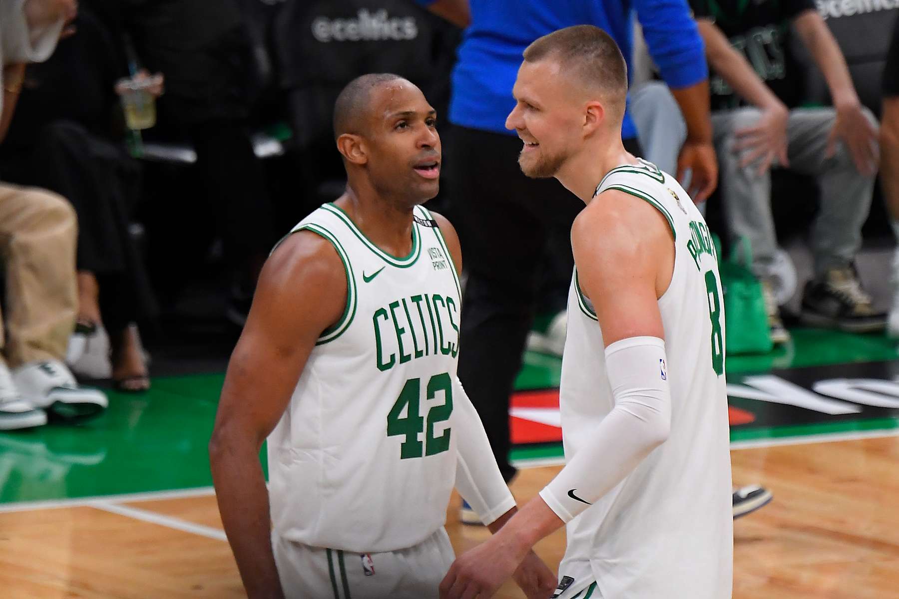 BOSTON, MA - JUNE 6: Al Horford #42 and Kristaps Porzingis #8 of the Boston Celtics looks on during the game against the Dallas Mavericks during Game 1 of the 2024 NBA Finals on June 6, 2024 at the TD Garden in Boston, Massachusetts. NOTE TO USER: User expressly acknowledges and agrees that, by downloading and or using this photograph, User is consenting to the terms and conditions of the Getty Images License Agreement. Mandatory Copyright Notice: Copyright 2024 NBAE  (Photo by Brian Babineau/NBAE via Getty Images)