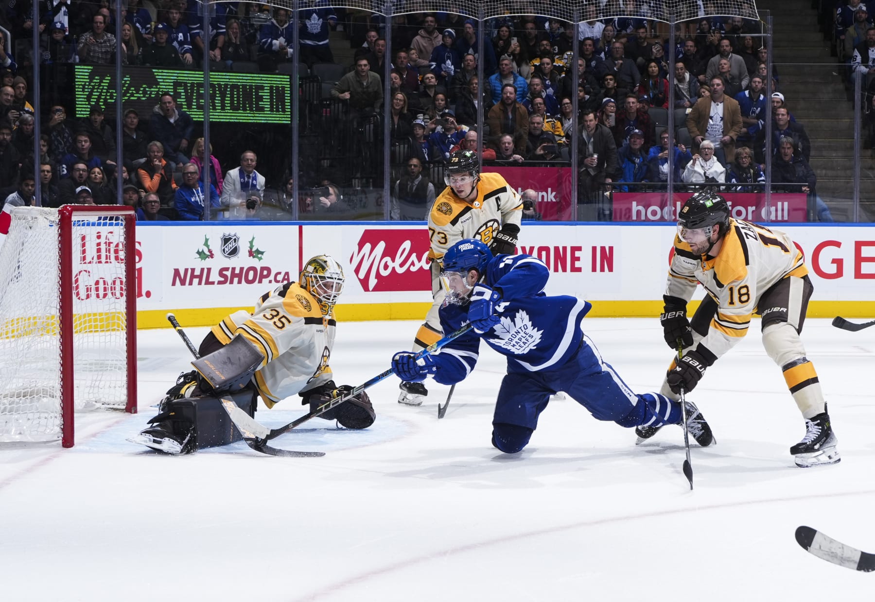 Toronto Maple Leafs winger Mitch Marner (right) and Boston Bruins goaltender Linus Ullmark. 