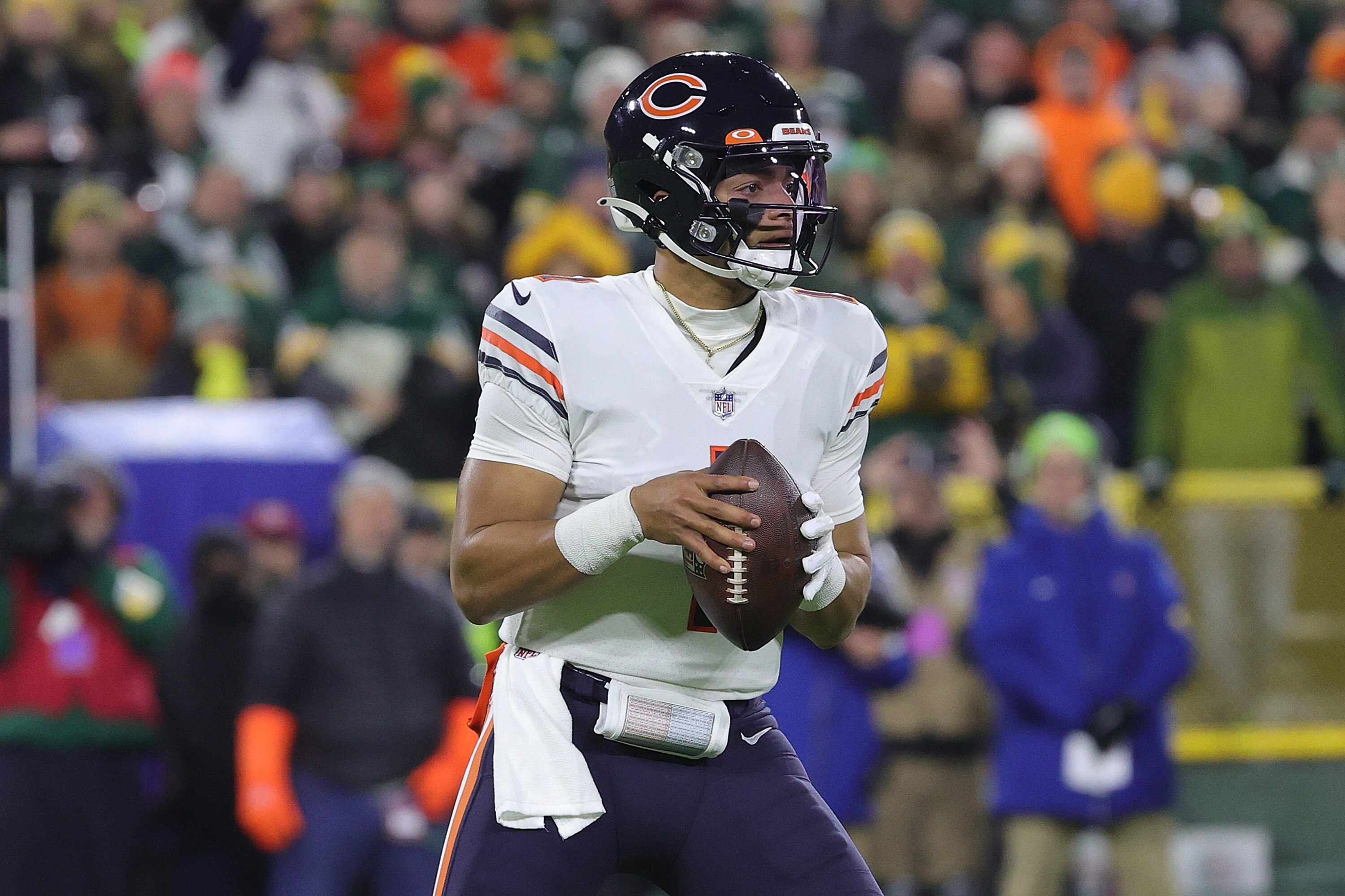 GREEN BAY, WISCONSIN - DECEMBER 12: Justin Fields #1 of the Chicago Bears drops back to pass during a game against the Green Bay Packers at Lambeau Field on December 12, 2021 in Green Bay, Wisconsin.  The Packers defeated the Bears 45-30. (Photo by Stacy Revere/Getty Images)