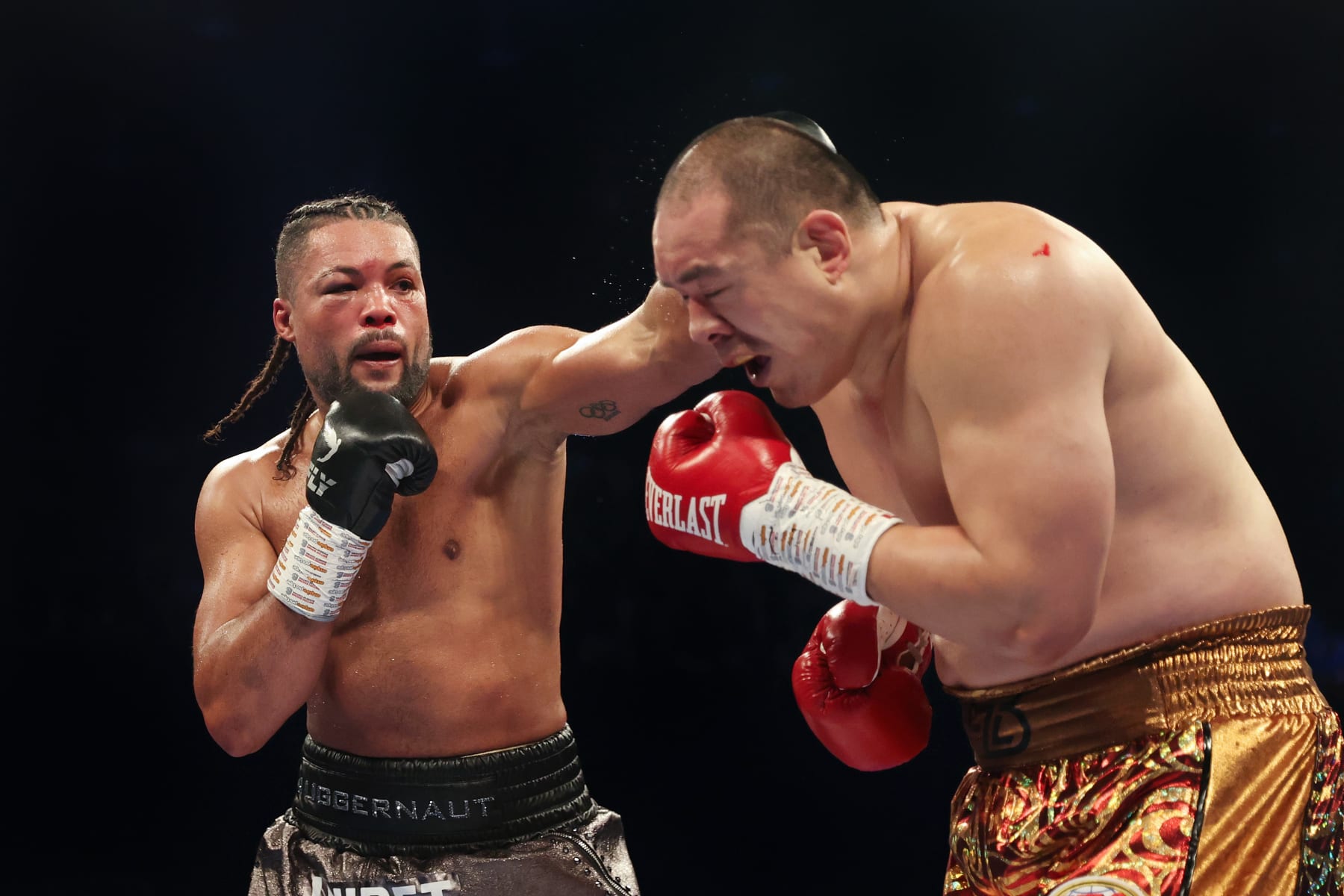 LONDON, ENGLAND - APRIL 15: Joe Joyce punches Zhilei Zhang during the WBO Interim World Heavyweight Title fight between Joe Joyce and Zhilei Zhang at Copper Box Arena on April 15, 2023 in London, England. (Photo by James Chance/Getty Images)