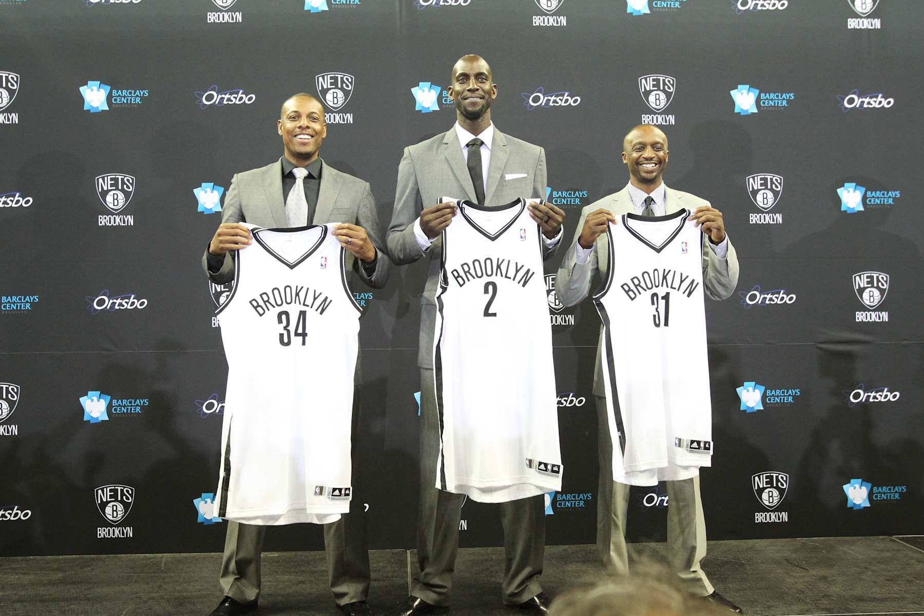 BROOKLYN, NY - July 18: Kevin Garnett #2, Paul Pierce #34, and Jason Terry #31 of the Brooklyn Nets pose with their new jerseys during a press conference at the Barclays Center on July 18, 2013 in the Brooklyn borough of New York City.  NOTE TO USER: User expressly acknowledges and agrees that, by downloading and/or using this Photograph, user is consenting to the terms and conditions of the Getty Images License Agreement. Mandatory Copyright Notice: Copyright 2013 NBAE (Photo by Nathaniel S. Butler/NBAE via Getty Images)
