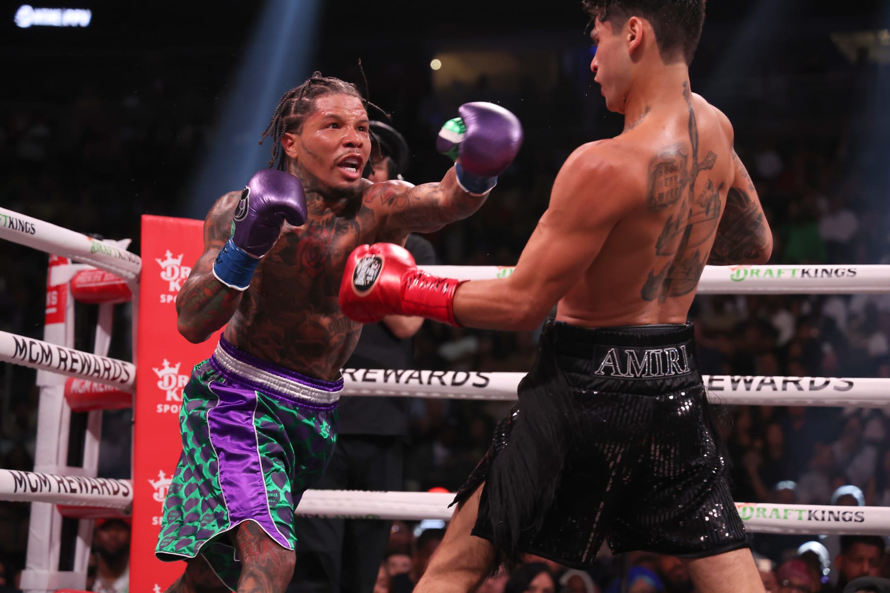 LAS VEGAS, NEVADA - APRIL 22: Gervonta Davis in the green and purple trunks punches Ryan Garcia in the black trunks during their catchweight bout at T-Mobile Arena on April 22, 2023 in Las Vegas, Nevada. (Photo by Al Bello/Getty Images)