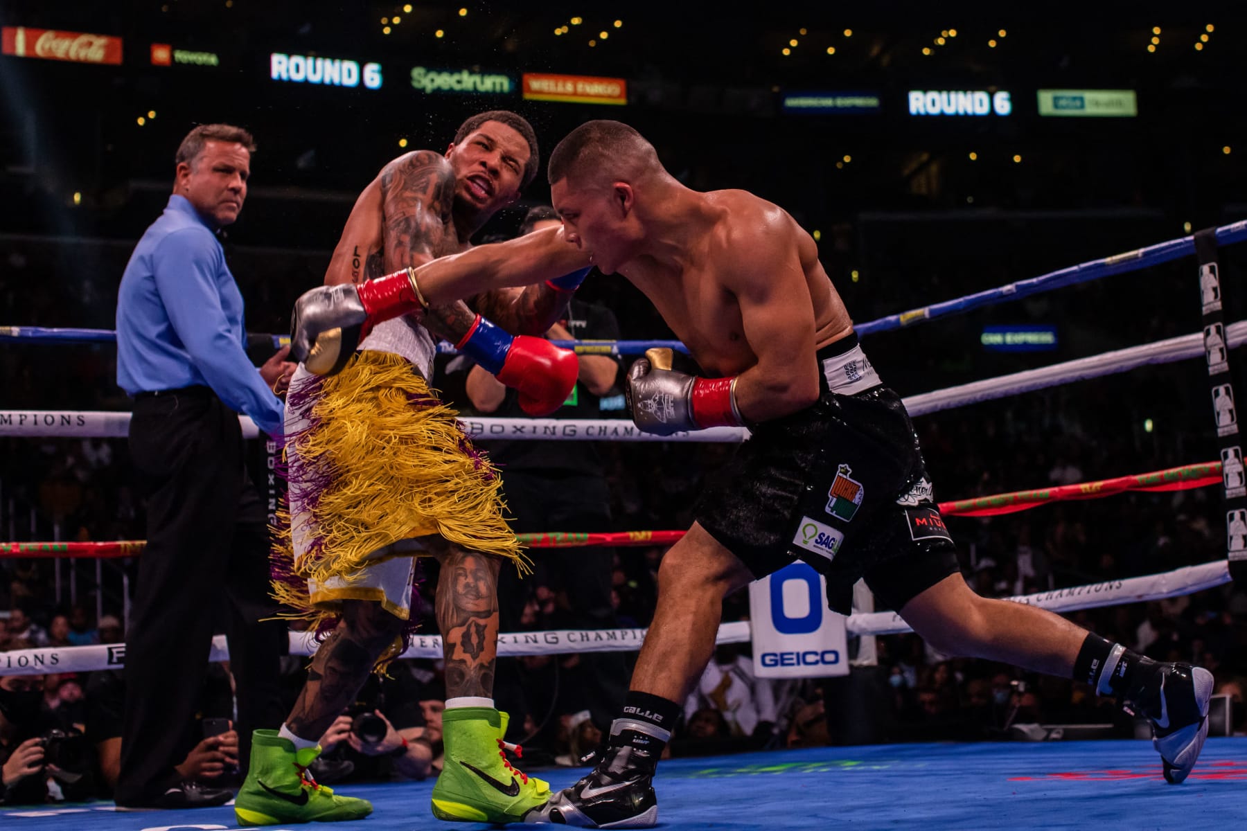 US boxer Gervonta Davis (L) fights Mexican boxer Isaac Cruz during their WBA Lightweight Championship bout at the Staples center in Los Angeles, California on December 5, 2021. (Photo by Apu GOMES / AFP) (Photo by APU GOMES/AFP via Getty Images)