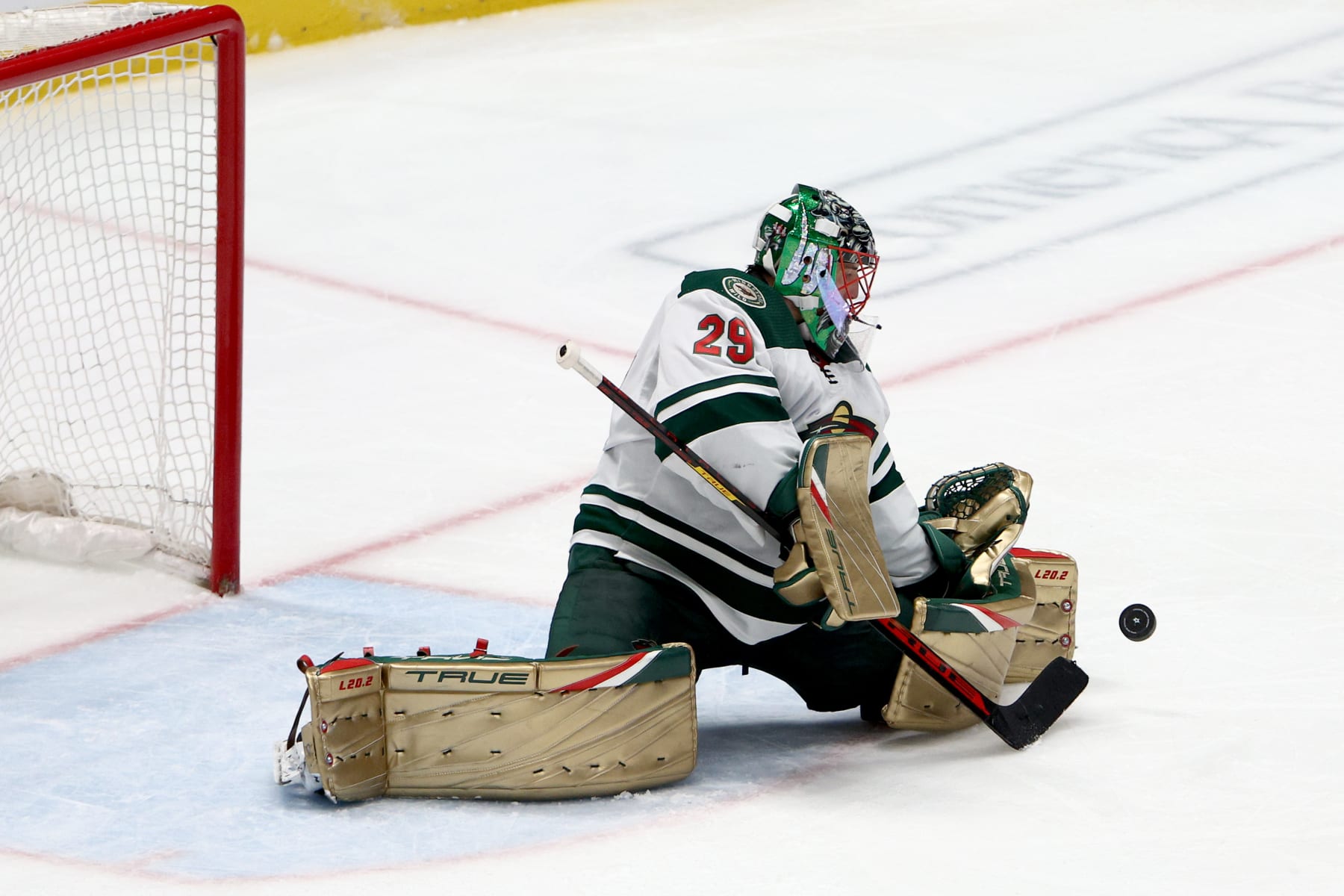 DALLAS, TEXAS - APRIL 14:  Marc-Andre Fleury #29 of the Minnesota Wild blocks a shot on goal against the Dallas Stars in the third period at American Airlines Center on April 14, 2022 in Dallas, Texas. (Photo by Tom Pennington/Getty Images)