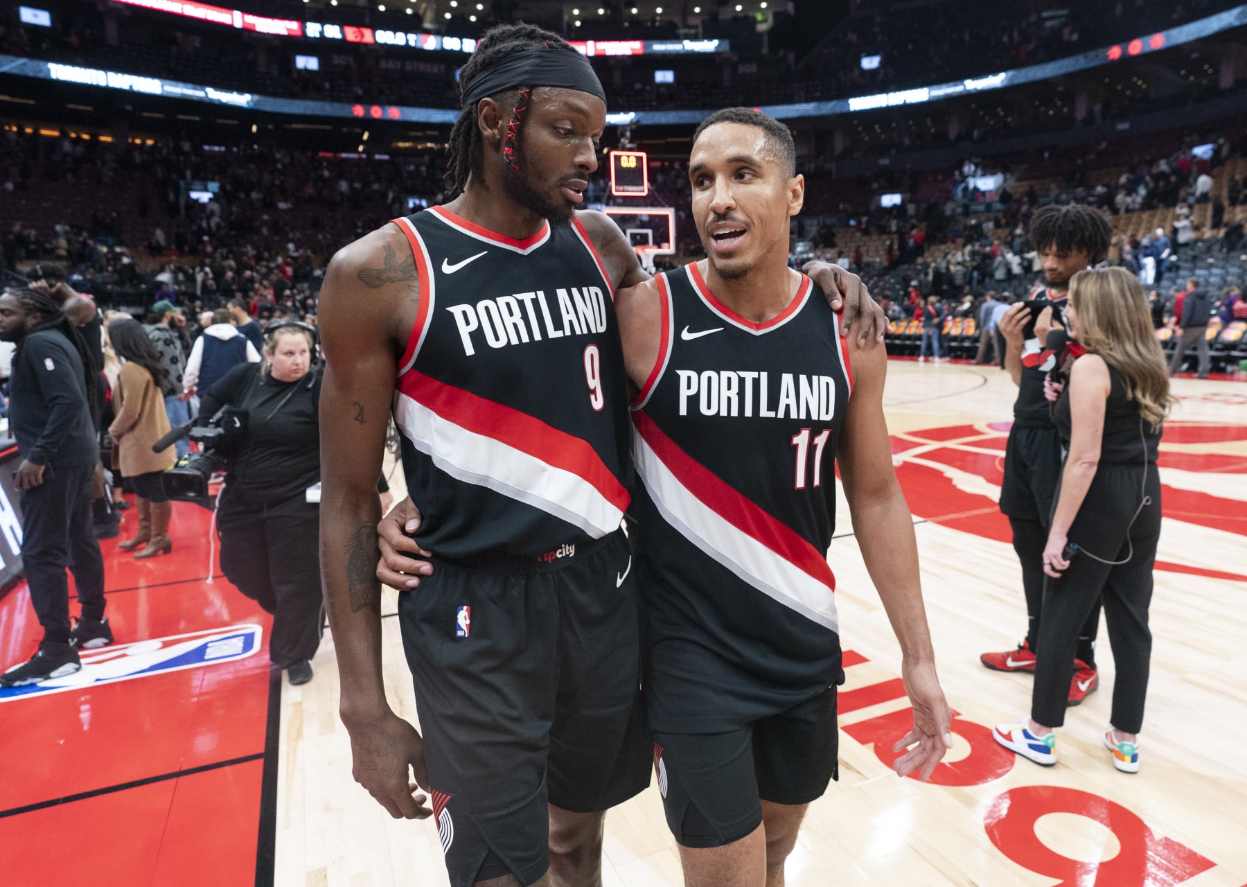 TORONTO, ON - OCTOBER 30: Malcolm Brogdon #11 and Jerami Grant #9 of the Portland Trail Blazers leave the floor after their team defeated the Toronto Raptors in their basketball game at the Scotiabank Arena on October 30, 2023 in Toronto, Ontario, Canada. NOTE TO USER: User expressly acknowledges and agrees that, by downloading and/or using this Photograph, user is consenting to the terms and conditions of the Getty Images License Agreement. (Photo by Mark Blinch/Getty Images)