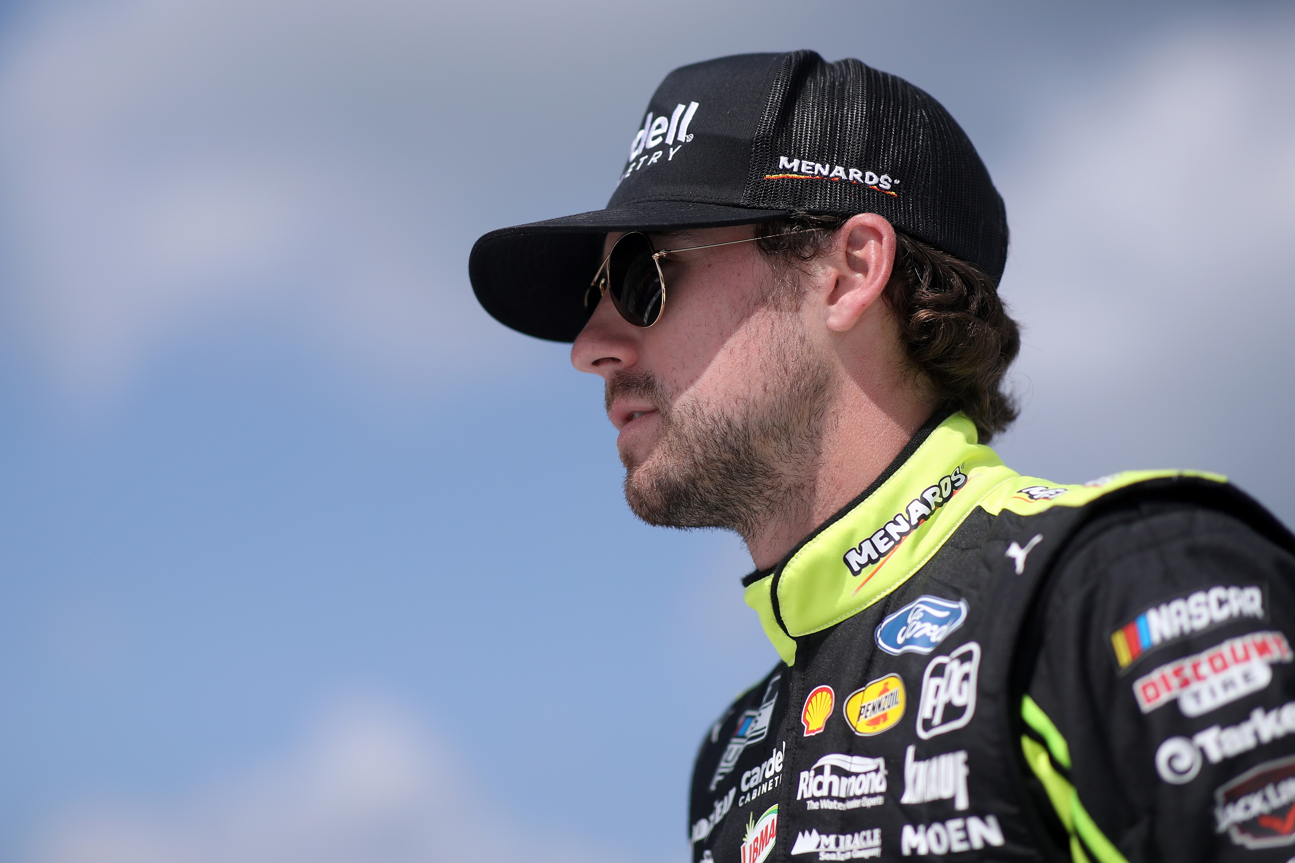 BROOKLYN, MICHIGAN - AUGUST 22: Ryan Blaney, driver of the #12 Menards/Cardell Cabinetry Ford, walks the grid driver introductions prior to the NASCAR Cup Series FireKeepers Casino 400 at Michigan International Speedway on August 22, 2021 in Brooklyn, Michigan. (Photo by Sean Gardner/Getty Images)