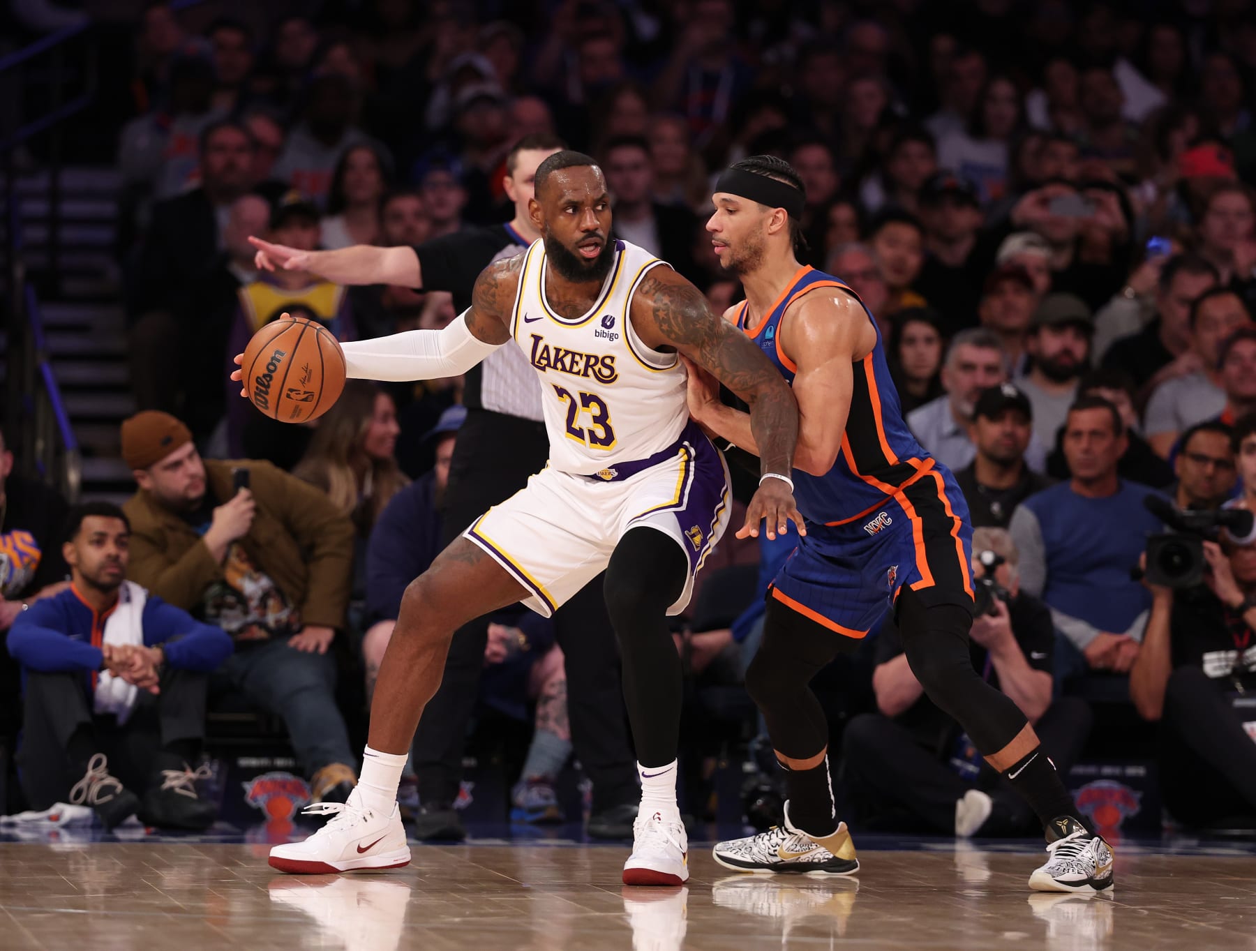 NEW YORK, NEW YORK - FEBRUARY 03: LeBron James #23 of the Los Angeles Lakers dribbles against Precious Achiuwa #5 of the New York Knicks during their game at Madison Square Garden on February 03, 2024 in New York City.   User expressly acknowledges and agrees that, by downloading and or using this photograph, User is consenting to the terms and conditions of the Getty Images License Agreement.  (Photo by Al Bello/Getty Images)
