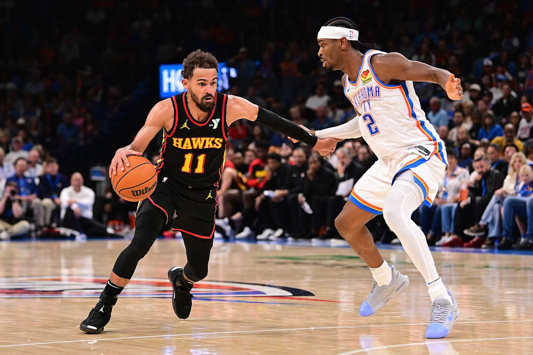 OKLAHOMA CITY, OKLAHOMA - OCTOBER 27: Trae Young #11 of the Atlanta Hawks attempts to drive past Shai Gilgeous-Alexander #2 of the Oklahoma City Thunder during the second half at Paycom Center on October 27, 2024 in Oklahoma City, Oklahoma. NOTE TO USER: User expressly acknowledges and agrees that, by downloading and or using this photograph, User is consenting to the terms and conditions of the Getty Images License Agreement. (Photo by Joshua Gateley/Getty Images)