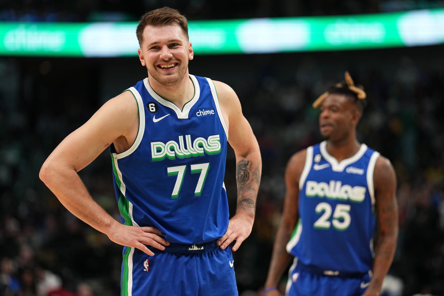 DALLAS, TX - DECEMBER 25: Luka Doncic #77 of the Dallas Mavericks smiles during the game against the Los Angeles Lakers on December 25, 2022 at the American Airlines Center in Dallas, Texas. NOTE TO USER: User expressly acknowledges and agrees that, by downloading and or using this photograph, User is consenting to the terms and conditions of the Getty Images License Agreement. Mandatory Copyright Notice: Copyright 2022 NBAE (Photo by Glenn James/NBAE via Getty Images)