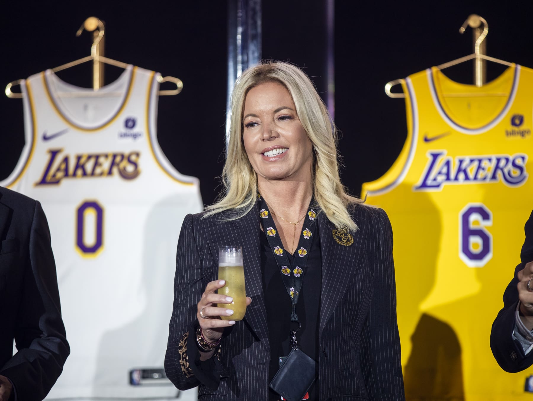 EL SEGUNDO, CA - September 20: Jeanie Buss, CEO / Governor / Co-owner of the Los Angeles Lakers, holds a new Lakers jersey as the Lakers host a 2021-2022 season kick-off event to unveil and announce a new global marketing partnership with Bibigo, which will appear on the Lakers jersey at the UCLA Health Training Center in El Segundo on Monday, Sept. 20, 2021. (Allen J. Schaben / Los Angeles Times via Getty Images)