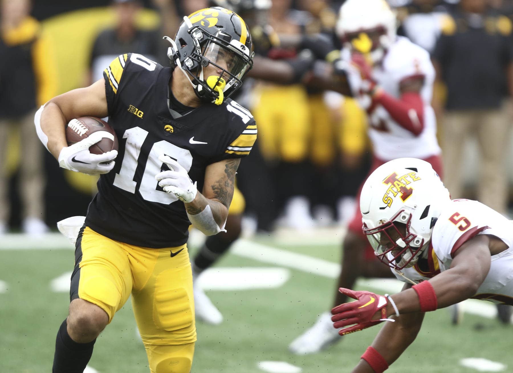IOWA CITY, IOWA- SEPTEMBER 10:  Running back Arland Bruce IV #10 of the Iowa Hawkeyes goes up the field during the first half against defensive back Myles Purchase #5 of the Iowa State Cyclones at Kinnick Stadium, on September 10, 2022 in Iowa City, Iowa.  (Photo by Matthew Holst/Getty Images)