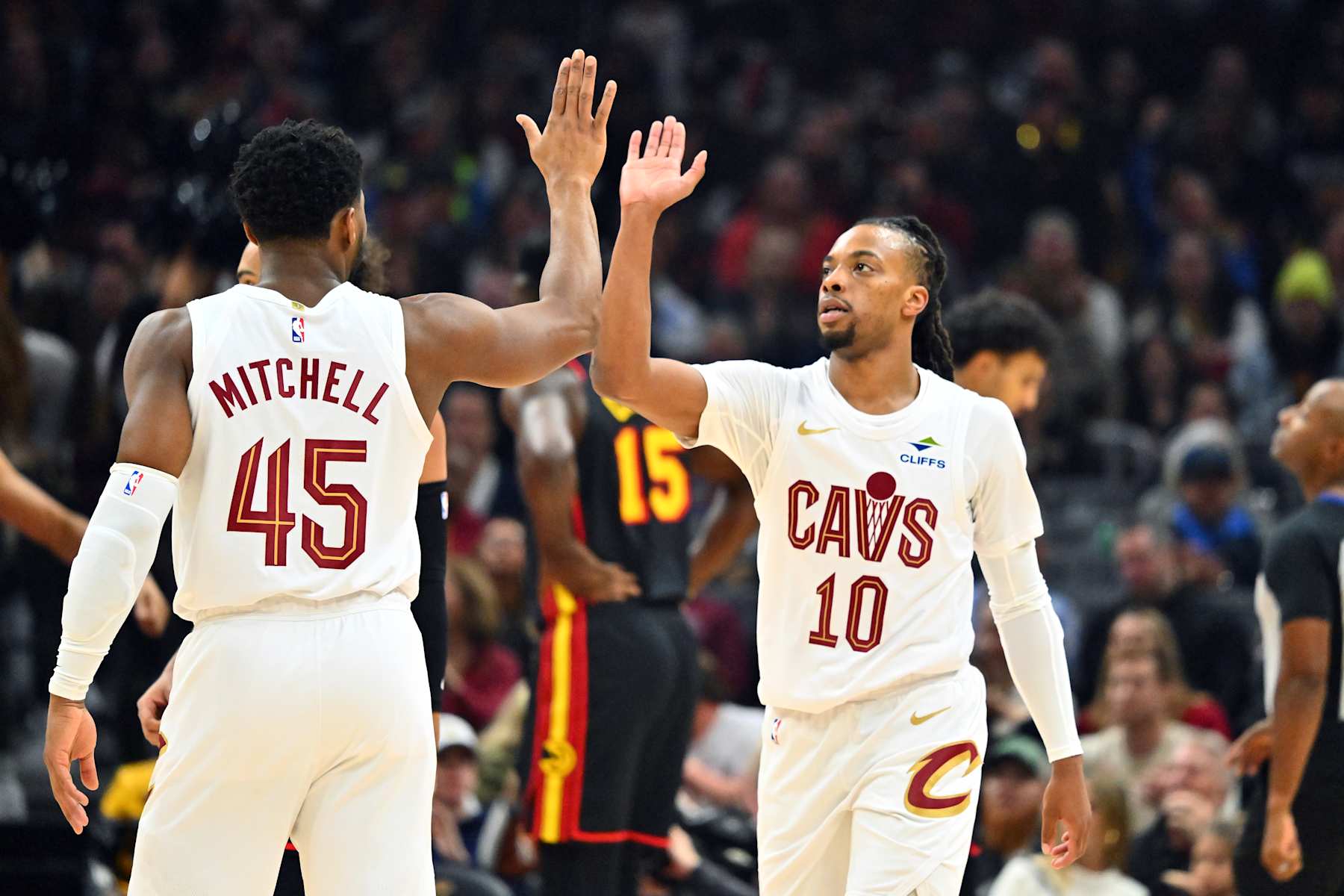 CLEVELAND, OHIO - NOVEMBER 27: Donovan Mitchell #45 celebrates with Darius Garland #10 of the Cleveland Cavaliers during the first half against the Atlanta Hawks at Rocket Mortgage Fieldhouse on November 27, 2024 in Cleveland, Ohio. NOTE TO USER: User expressly acknowledges and agrees that, by downloading and or using this photograph, User is consenting to the terms and conditions of the Getty Images License Agreement. (Photo by Jason Miller/Getty Images)