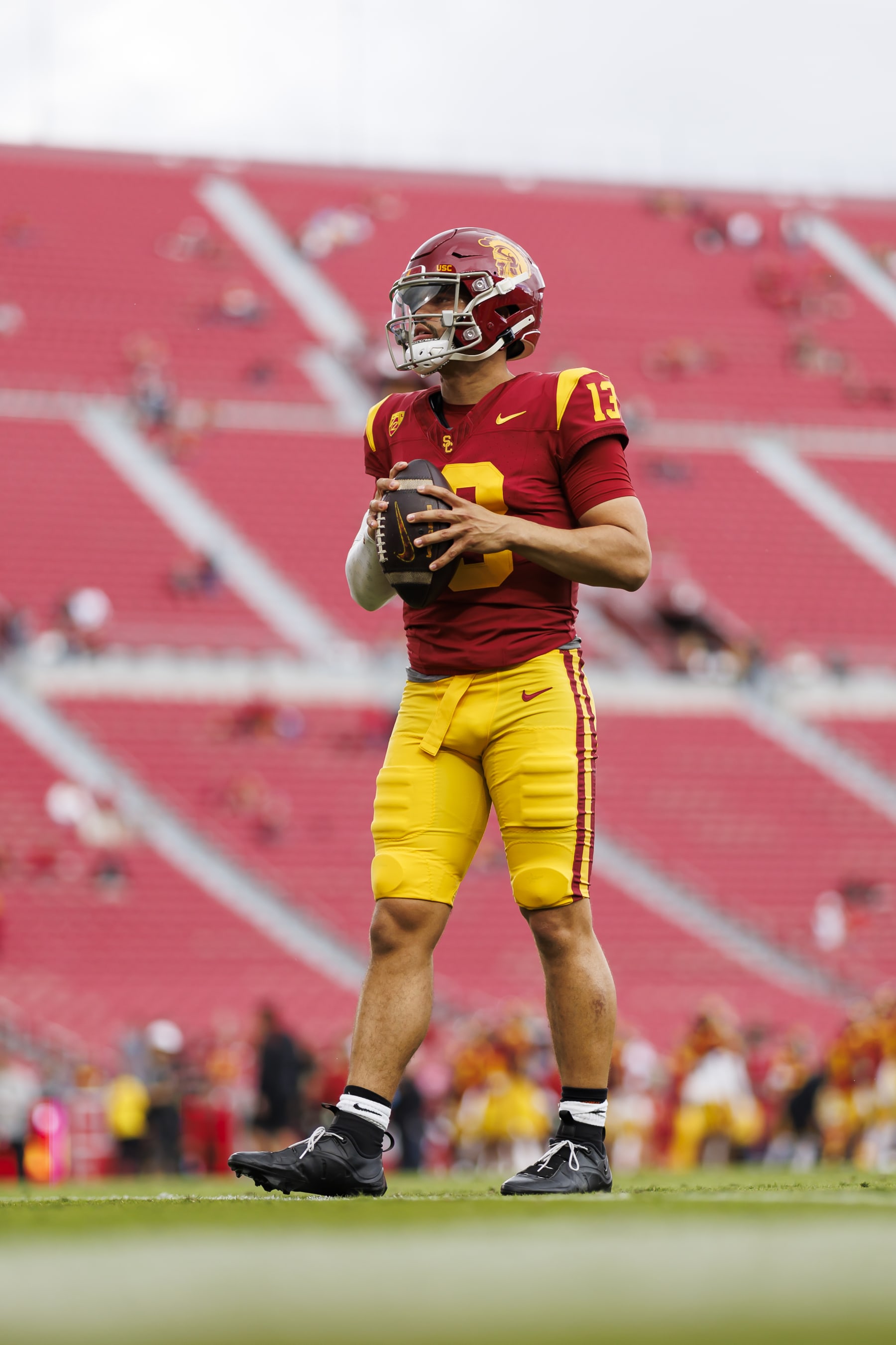 LOS ANGELES, CALIFORNIA - NOVEMBER 18: Caleb Williams #13 of the USC Trojans looks to throw a pass prior to a game against the UCLA Bruins at United Airlines Field at the Los Angeles Memorial Coliseum on November 18, 2023 in Los Angeles, California. (Photo by Ryan Kang/Getty Images)