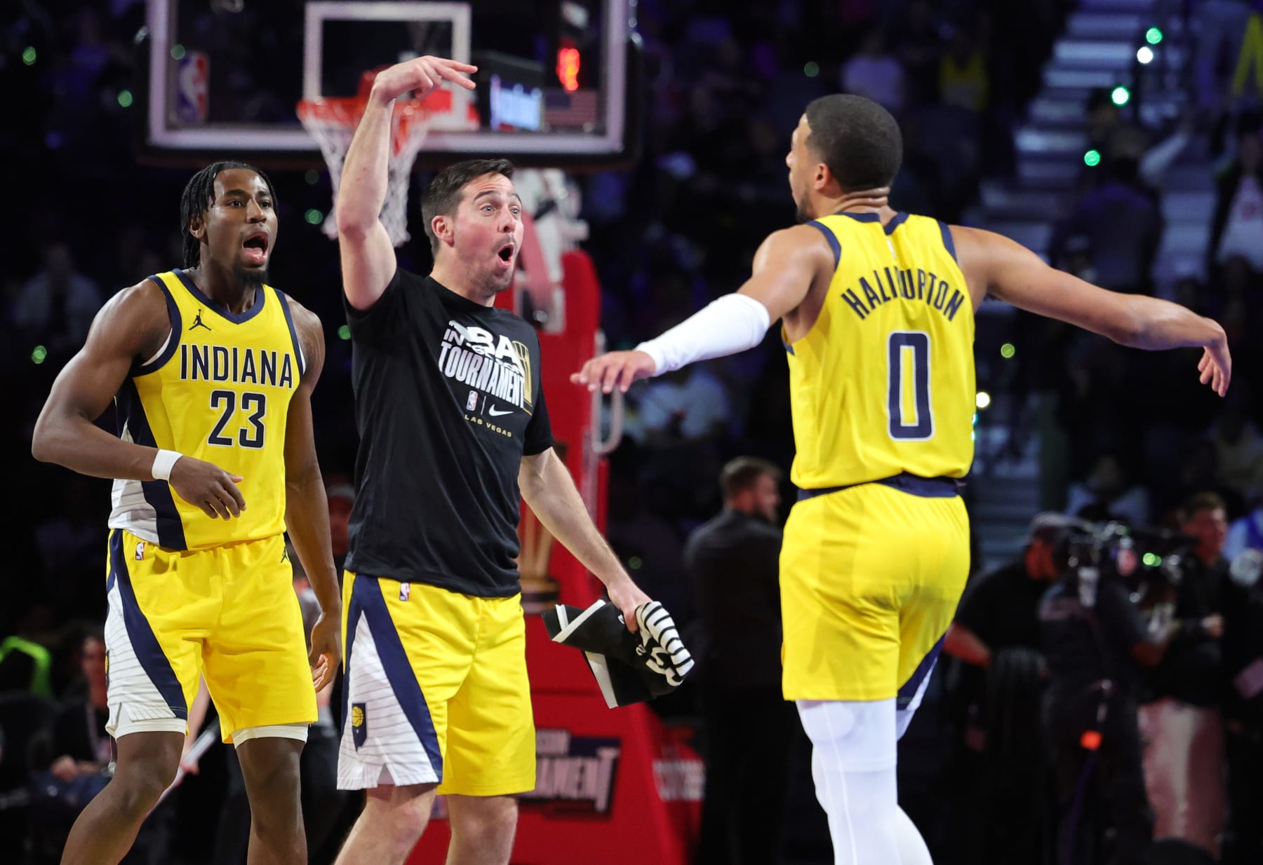 LAS VEGAS, NEVADA - DECEMBER 07: Aaron Nesmith #23, T.J. McConnell #9 and Tyrese Haliburton #0 of the Indiana Pacers celebrate after Haliburton hit a 3-pointer against the Milwaukee Bucks in the second half of the East semifinal game of the inaugural NBA In-Season Tournament at T-Mobile Arena on December 07, 2023 in Las Vegas, Nevada. The Pacers defeated the Bucks 128-119. NOTE TO USER: User expressly acknowledges and agrees that, by downloading and or using this photograph, User is consenting to the terms and conditions of the Getty Images License Agreement. (Photo by Ethan Miller/Getty Images)