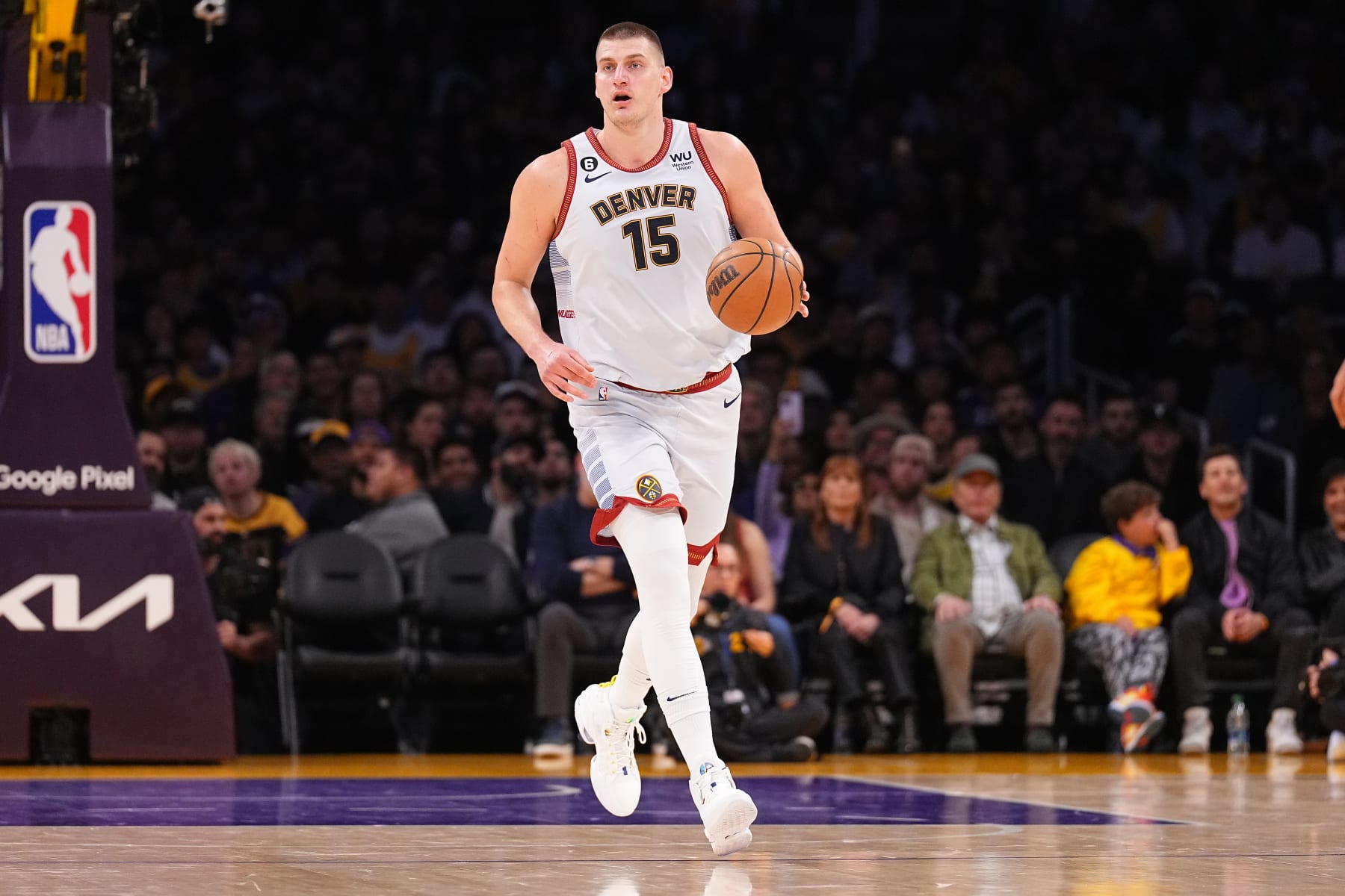 LOS ANGELES, CA - MAY 22: Nikola Jokic #15 of the Denver Nuggets dribbles the ball during Game Four of the Western Conference Finals against the Los Angeles Lakers on May 22, 2023 at Crypto.com Arena in Los Angeles, California. NOTE TO USER: User expressly acknowledges and agrees that, by downloading and/or using this Photograph, user is consenting to the terms and conditions of the Getty Images License Agreement. Mandatory Copyright Notice: Copyright 2023 NBAE (Photo by Garrett Ellwood/NBAE via Getty Images)