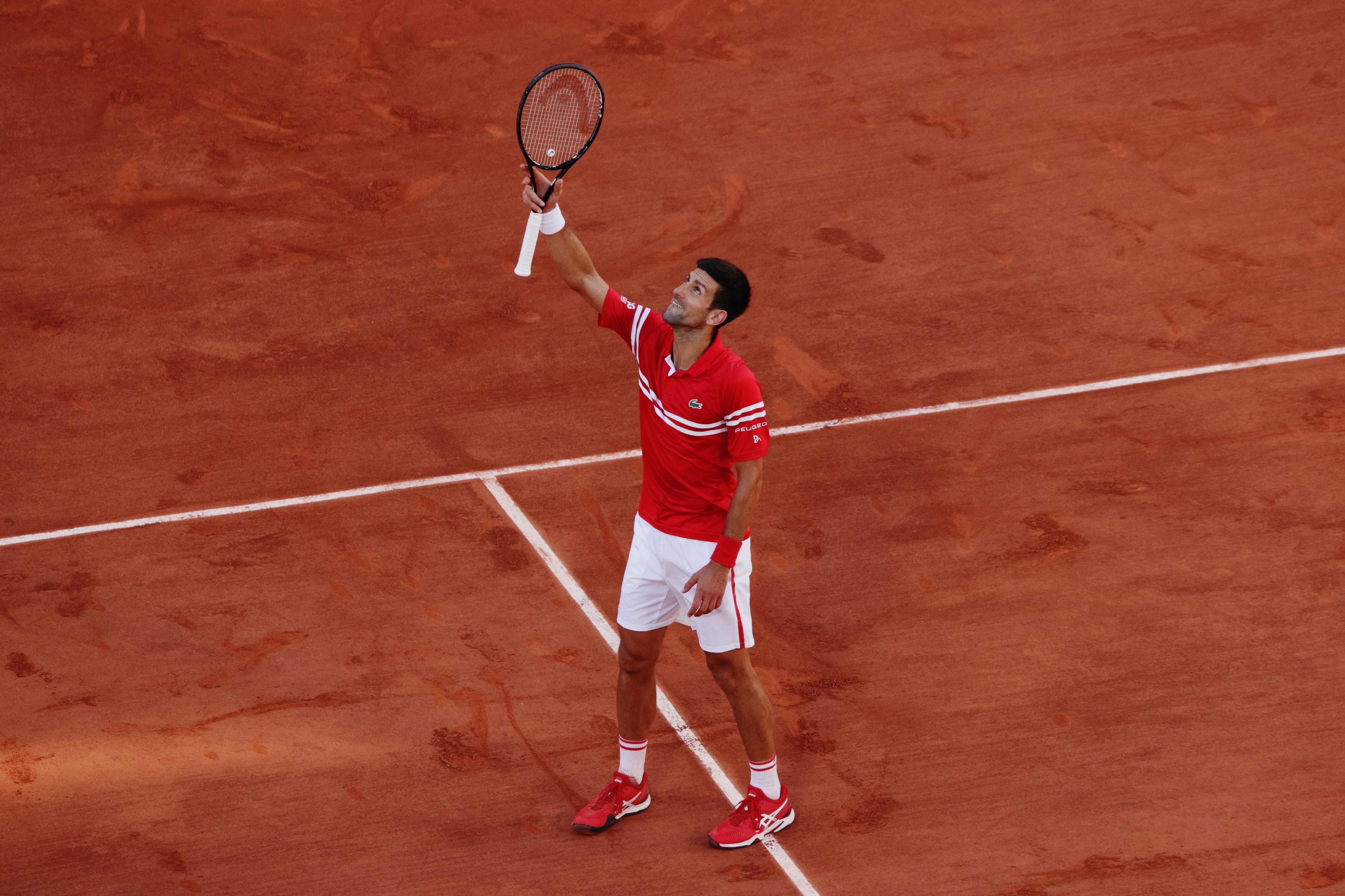 PARIS, FRANCE - JUNE 13: Novak Djokovic of Serbia celebrates victory after winning his Men's Singles Final match against Stefanos Tsitsipas of Greece during Day Fifteen of the 2021 French Open at Roland Garros on June 13, 2021 in Paris, France. (Photo by Adam Pretty/Getty Images)
