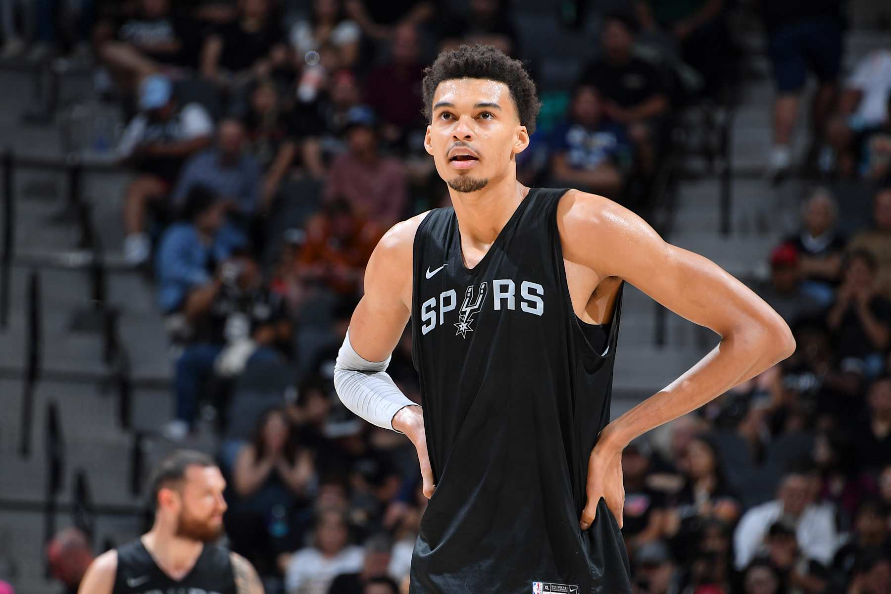San Antonio TX, - October 19, 2024: Victor Wembanyama #1 of the San Antonio Spurs looks on during the Spurs Open Scrimmage on October 19, 2024 at the Frost Bank Center in San Antonio, Texas. NOTE TO USER: User expressly acknowledges and agrees that, by downloading and or using this photograph, user is consenting to the terms and conditions of the Getty Images License Agreement. Mandatory Copyright Notice: Copyright 2024 NBAE (Photos by Michael Gonzales/NBAE via Getty Images)